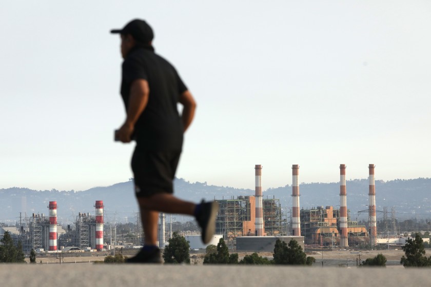 The steam stacks of the Los Angeles DWP Valley Generating Station in Sun Valley is seen from the Hansen Dam bike path in an undated photo. (Myung J. Chun / Los Angeles Times)