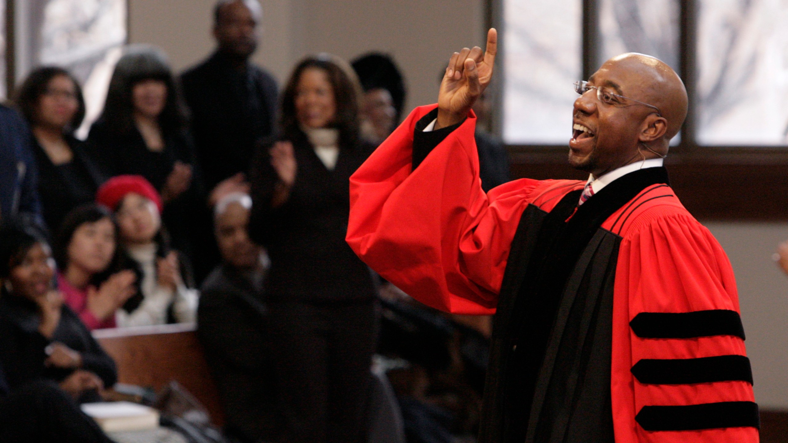 In this Sunday Jan. 18, 2009 file photo, Rev. Raphael Warnock delivers a sermon during a church service at Ebenezer Baptist Church in Atlanta. (AP Photo/John Amis)