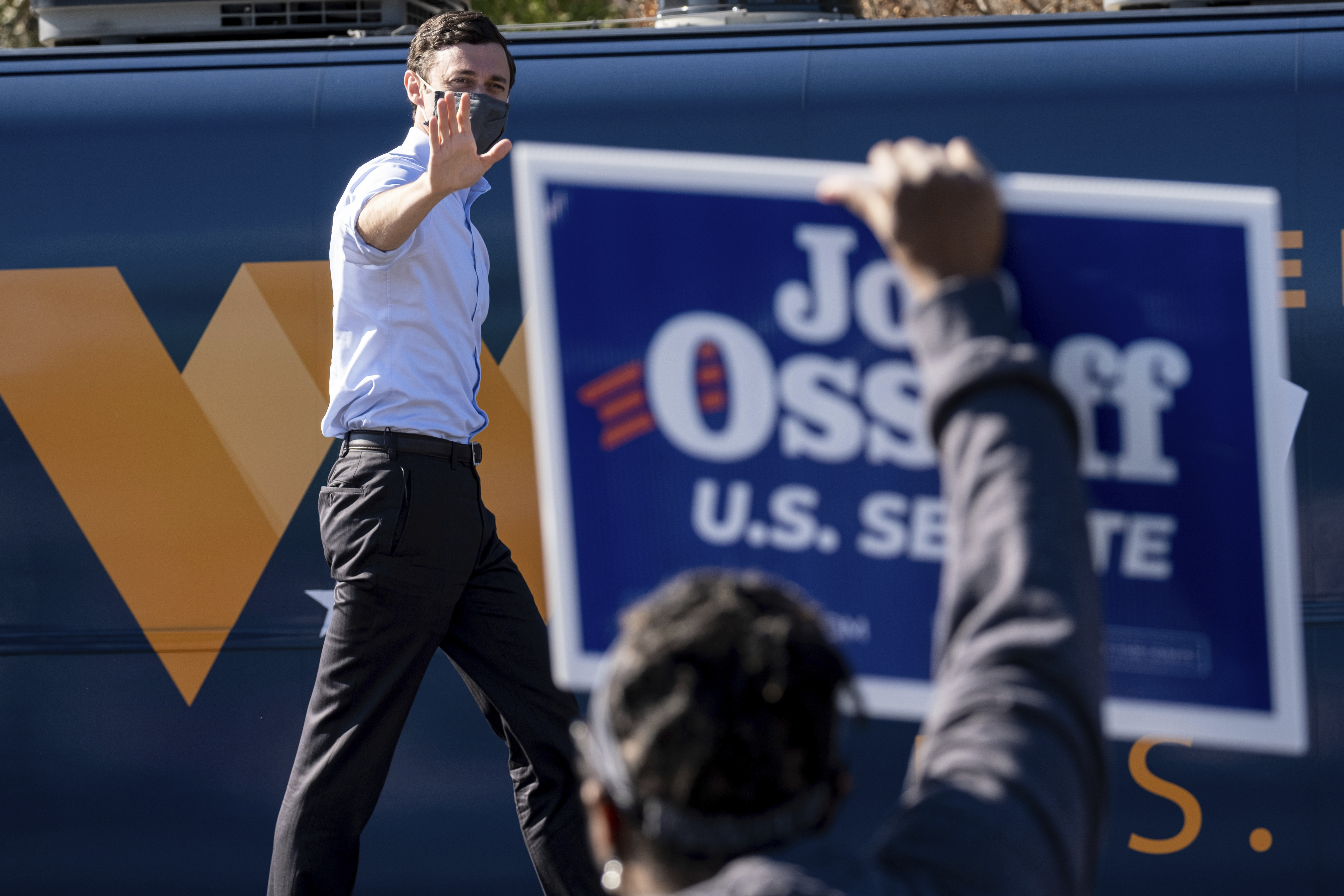 In this Dec. 21, 2020, file photo Democratic U.S. Senate challenger Jon Ossoff during a rally in Columbus, Ga. with Vice President-elect Kamala Harris and fellow Democratic U.S. Senate challenger the Rev. Raphael Warnock. (Ben Gray/AP Photo)