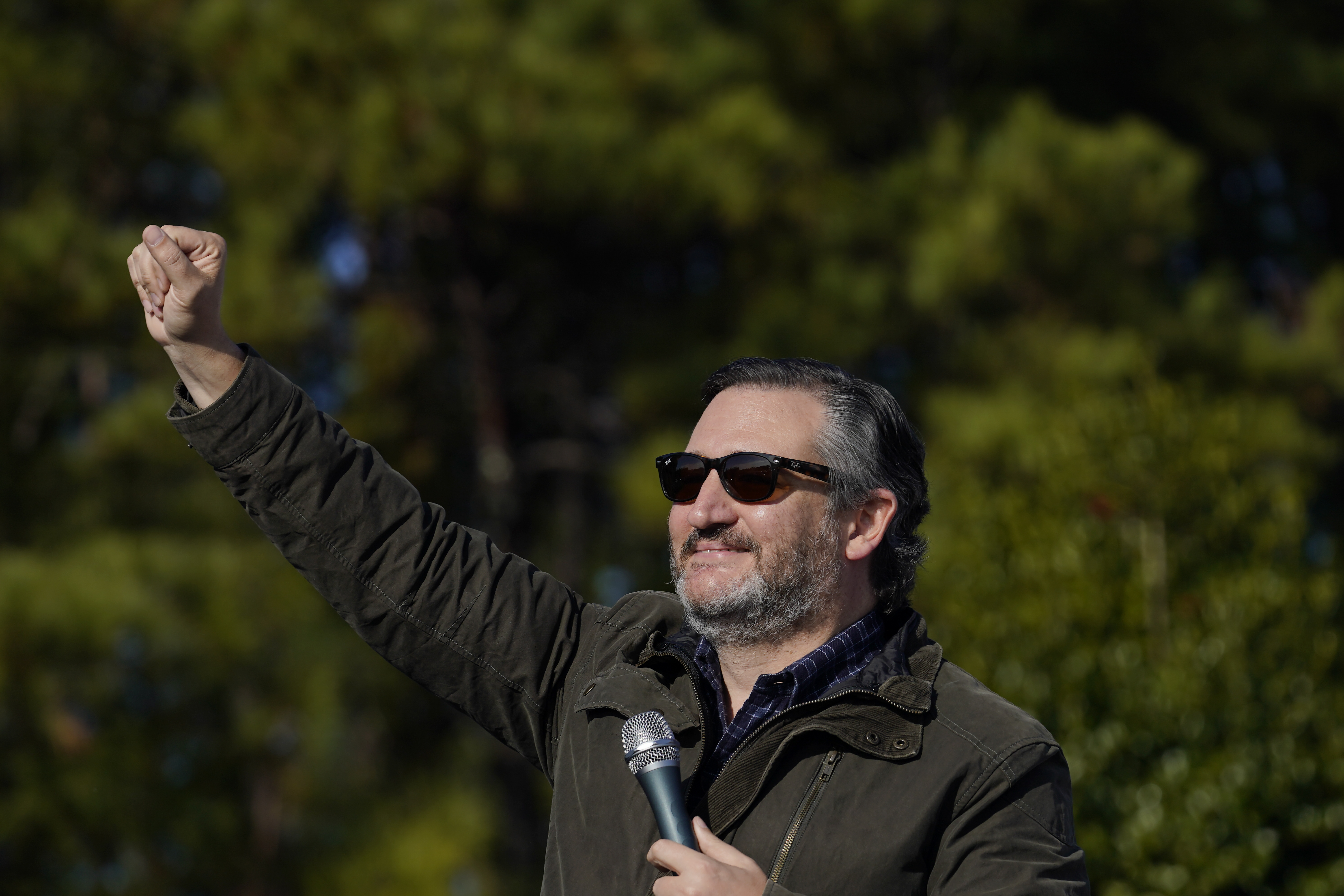 Sen. Ted Cruz, R-Texas, greets a crowd before he speaks at a campaign rally for Sen. Kelly Loeffler, R-Ga., on Saturday, Jan. 2, 2021, in Cumming, Ga. (AP Photo/Brynn Anderson)