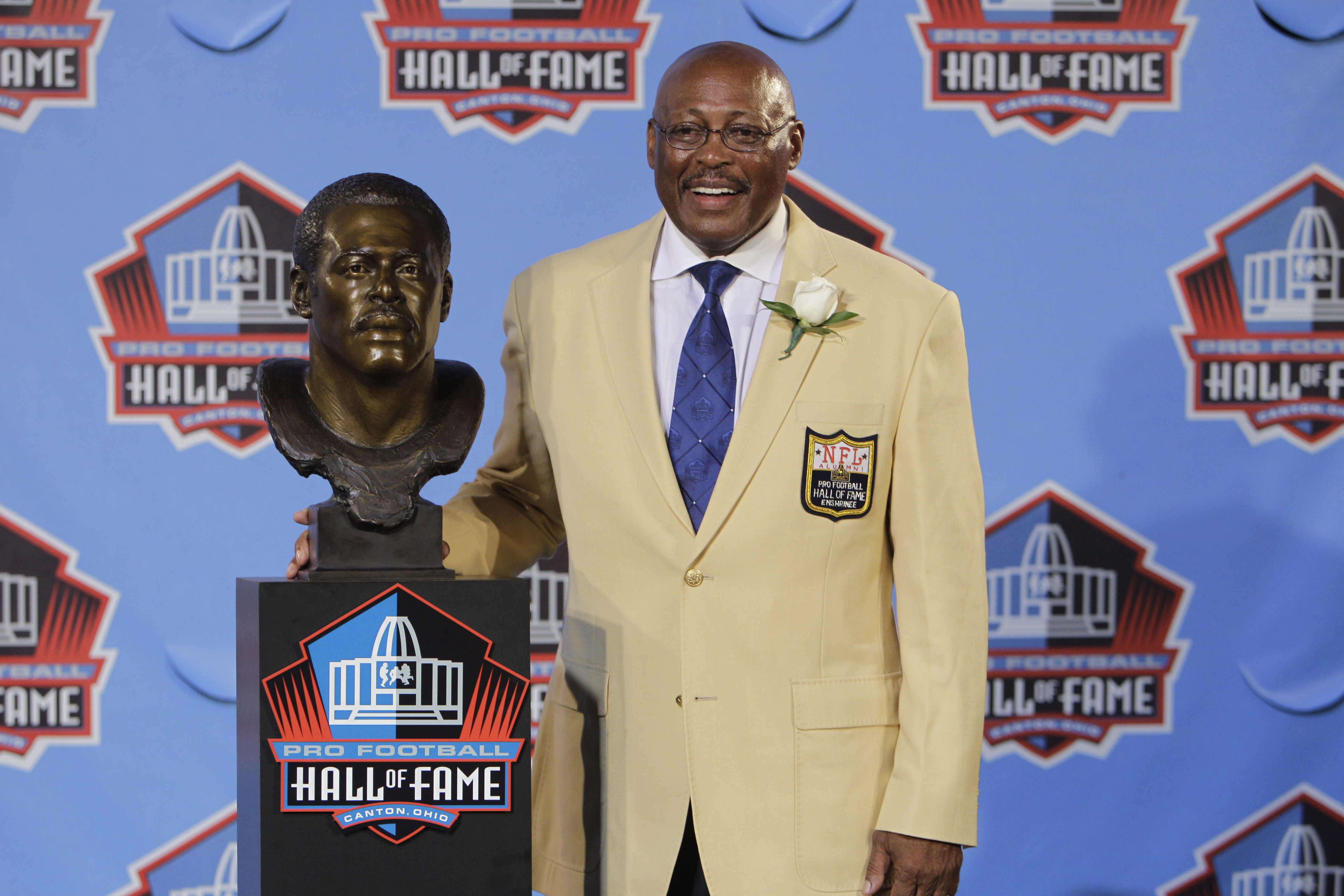 In this Aug. 7, 2010 file photo, Floyd Little poses with his bust after enshrinement in the Pro Football Hall of Fame in Canton, Ohio. (AP Photo/Mark Duncan, File)