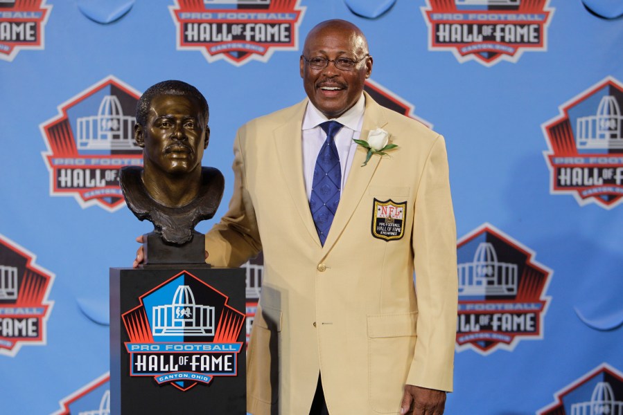 In this Aug. 7, 2010 file photo, Floyd Little poses with his bust after enshrinement in the Pro Football Hall of Fame in Canton, Ohio. (AP Photo/Mark Duncan, File)