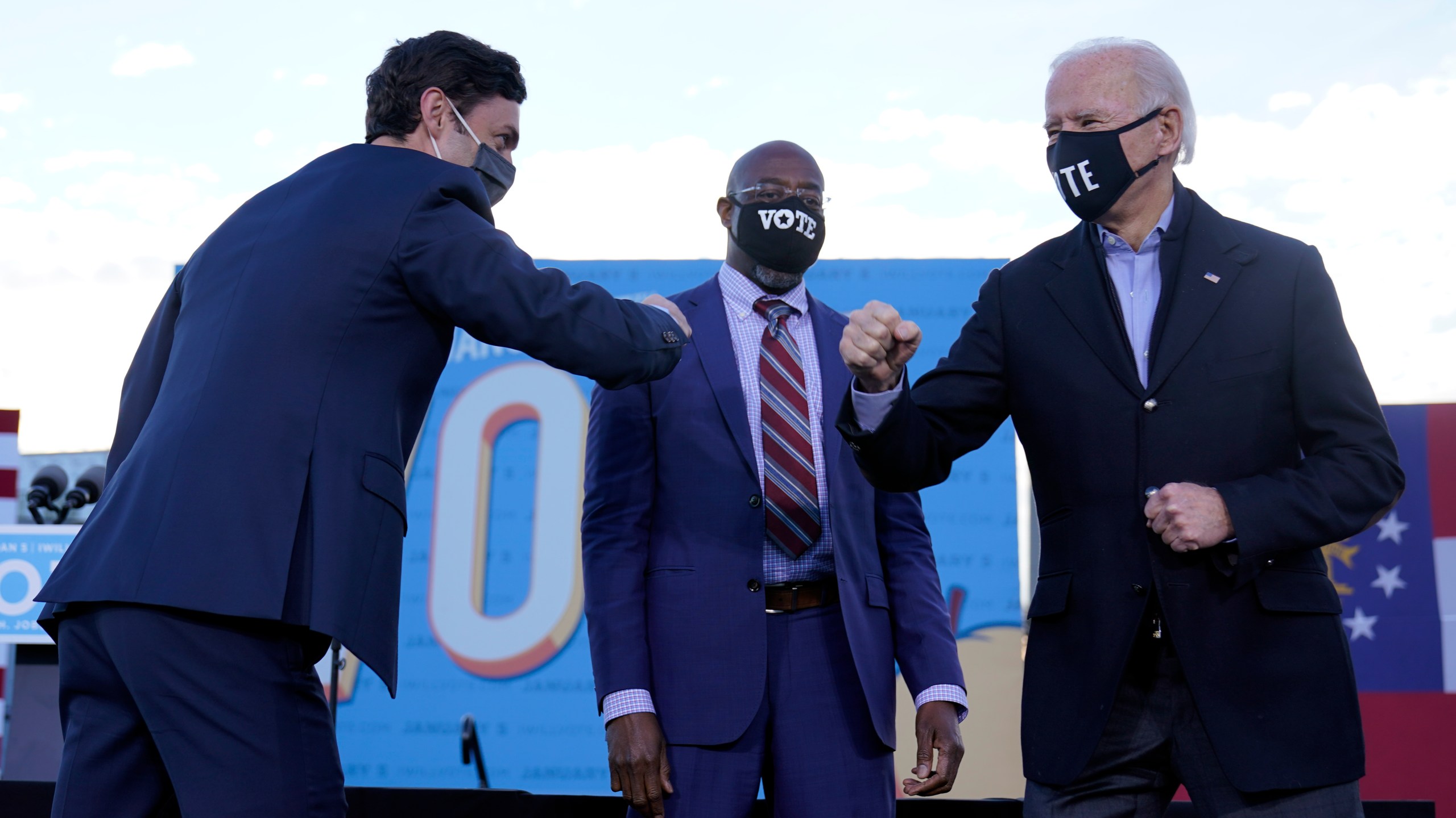 President-elect Joe Biden campaigns in Atlanta, Monday, Jan. 4, 2021, for Senate candidates Raphael Warnock, center, and Jon Ossoff, left. (AP Photo/Carolyn Kaster)