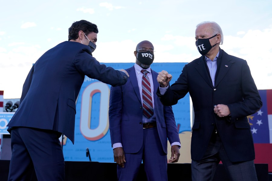 President-elect Joe Biden campaigns in Atlanta, Monday, Jan. 4, 2021, for Senate candidates Raphael Warnock, center, and Jon Ossoff, left. (AP Photo/Carolyn Kaster)