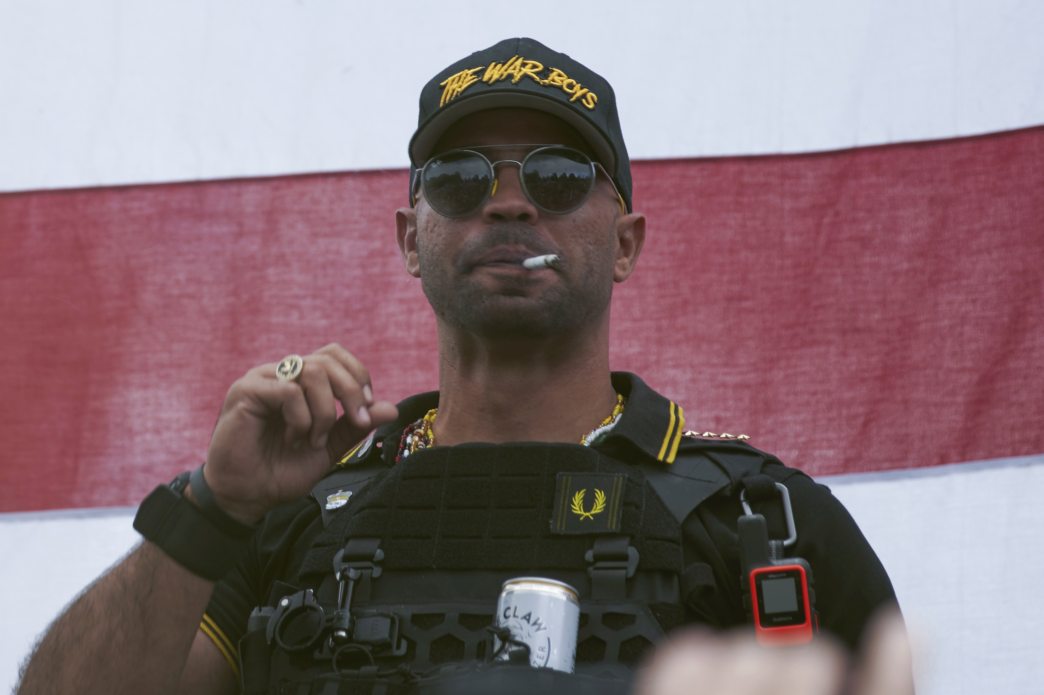 Proud Boys leader Henry "Enrique" Tarrio wears a hat that says The War Boys during a rally in Portland, Ore., on Sept. 26, 2020. (Allison Dinner / Associated Press)