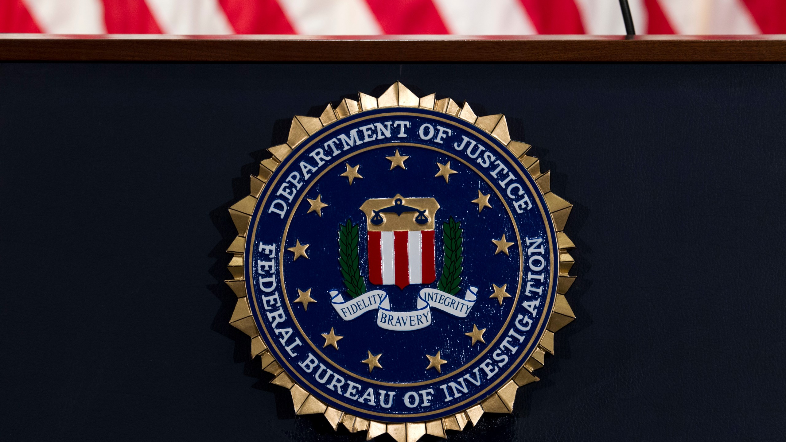 In this June 14, 2018, file photo, the FBI seal is seen before a news conference at FBI headquarters in Washington. (Jose Luis Magana/Associated Press)