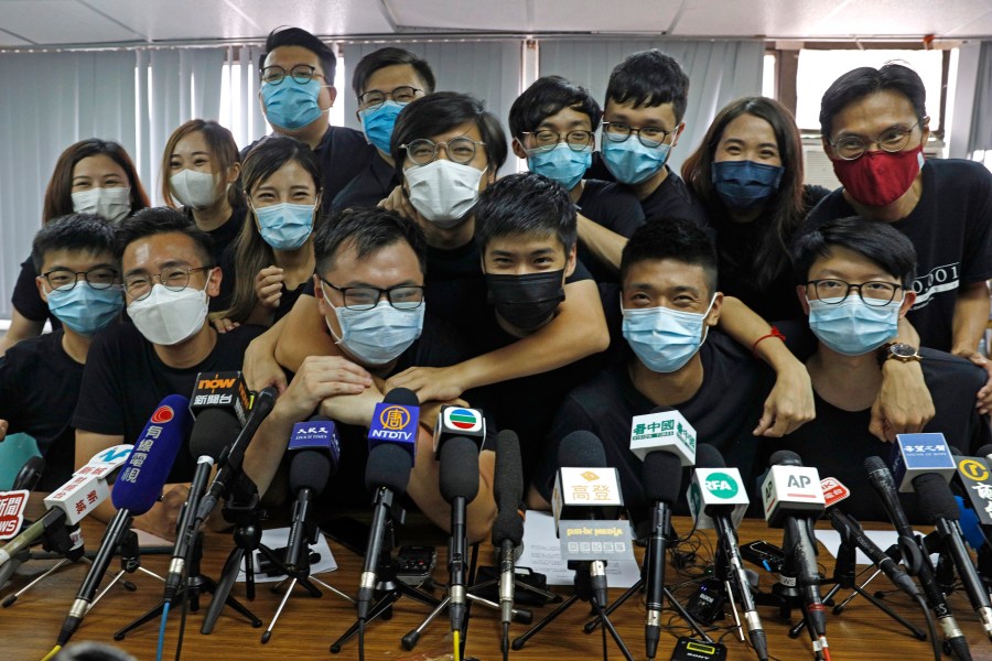 In this July 15, 2020, file photo, pro-democracy activists who were elected from unofficial pro-democracy primaries, including Joshua Wong, left, attend a press conference in Hong Kong. (Kin Cheung/AP Photo)