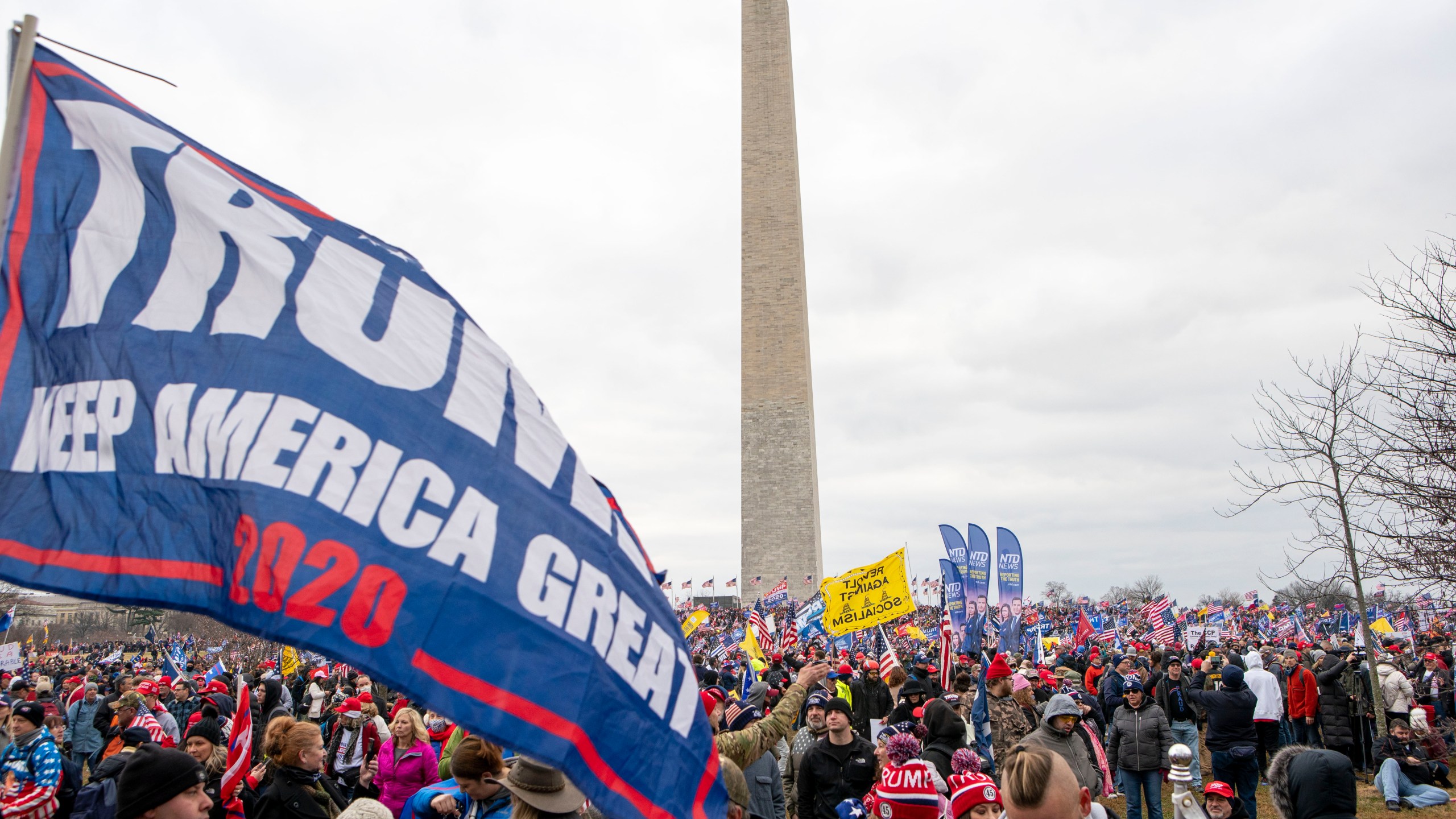 With the Washington Monument in the background, people attend a rally in support of President Donald Trump on Wednesday, Jan. 6, 2021, in Washington. (AP Photo/Jose Luis Magana)