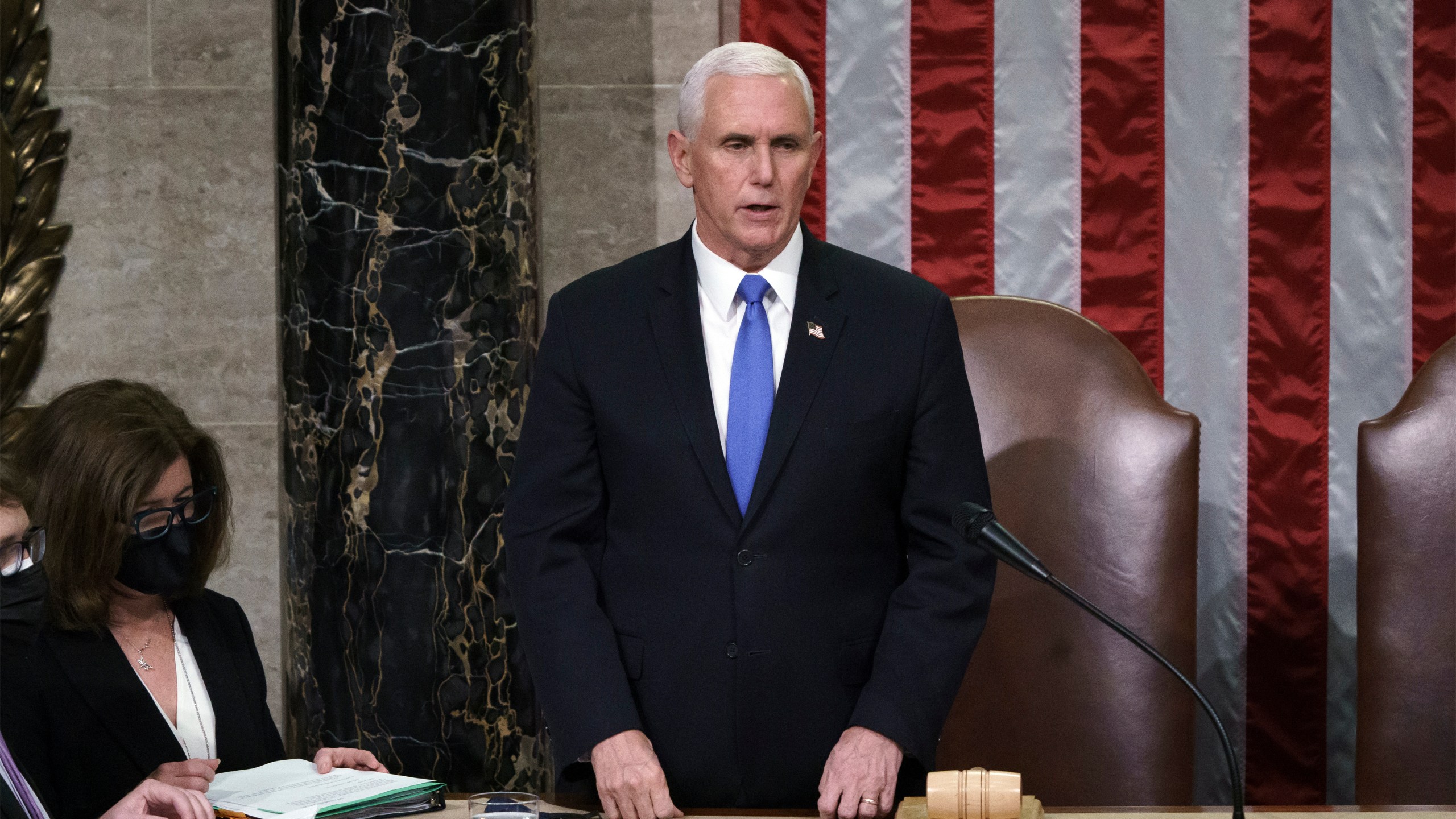 Vice President Mike Pence listens after reading the final certification of Electoral College votes cast in November's presidential election during a joint session of Congress after working through the night, at the Capitol in Washington, on Jan. 7, 2021. (J. Scott Applewhite / Associated Press)