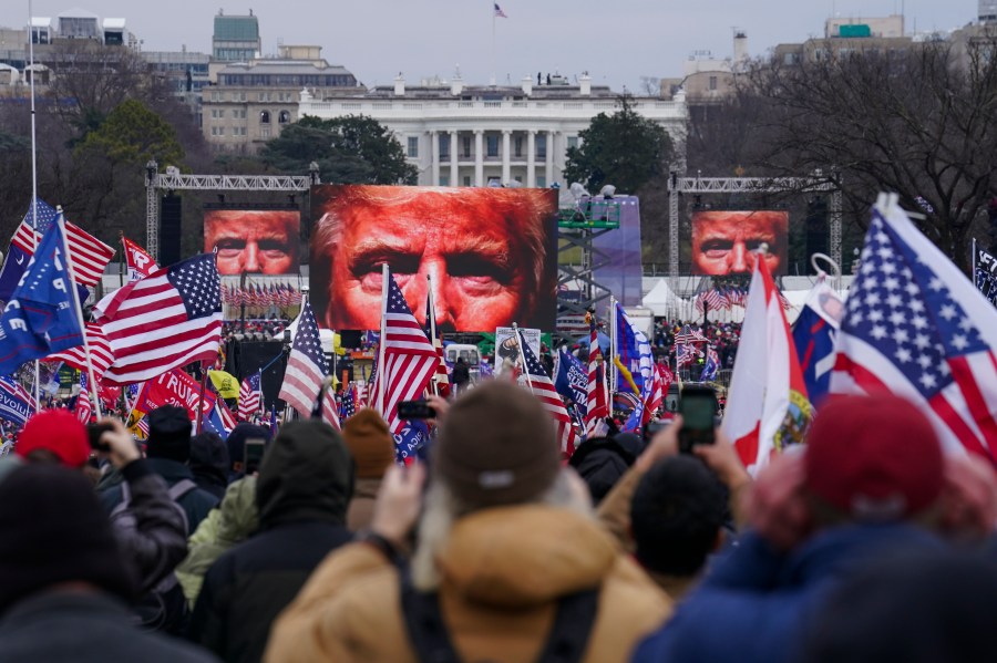 In this Jan. 6, 2021, file photo, Trump supporters participate in a rally in Washington. Far-right social media users for weeks openly hinted in widely shared posts that chaos would erupt at the U.S. Capitol while Congress convened to certify the election results. (AP Photo/John Minchillo)