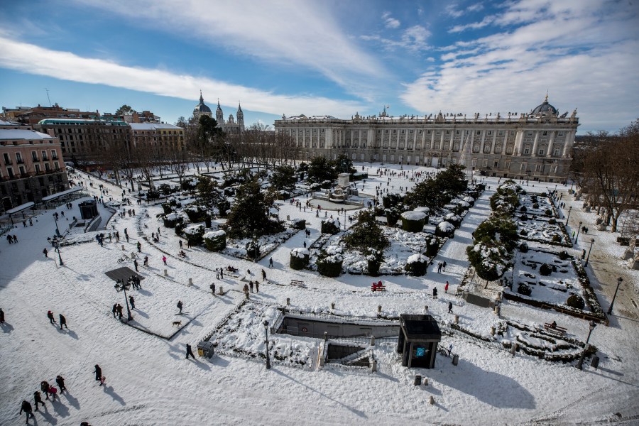 A view of Oriente square covered with snow with the Royal Palace in front in downtown Madrid is seen on Jan. 10, 2021. (Manu Fernandez/Associated Press)