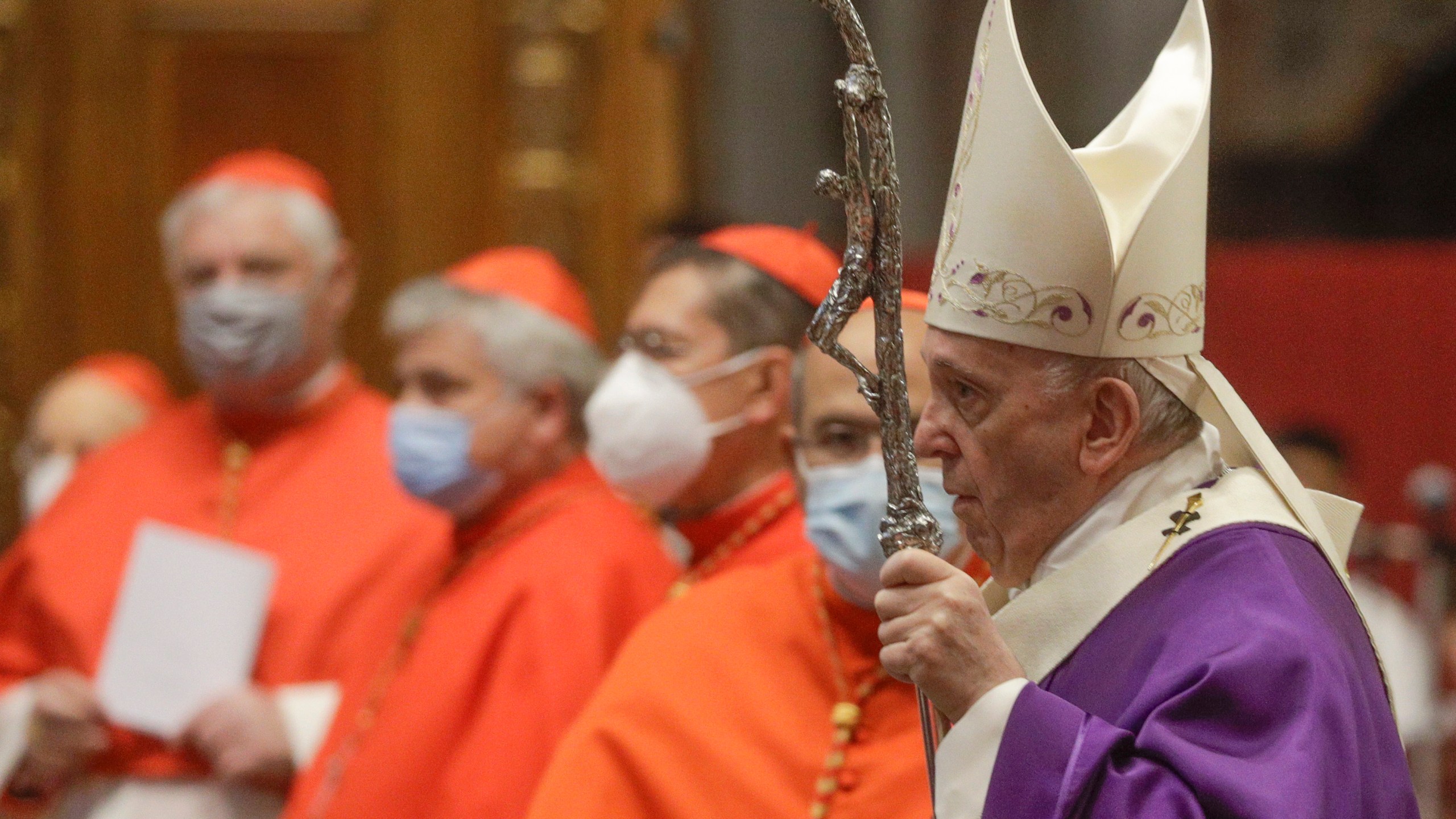 In this file photo dated Sunday, Nov. 29, 2020, Pope Francis holds his pastoral staff as he arrives to celebrate Mass, at St. Peter's Basilica. (AP Photo/Gregorio Borgia, FILE)