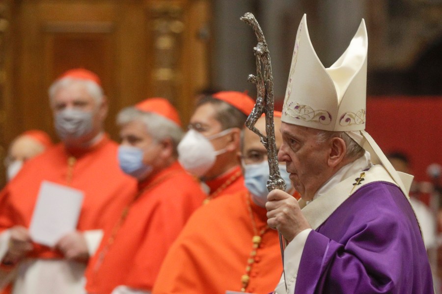 In this file photo dated Sunday, Nov. 29, 2020, Pope Francis holds his pastoral staff as he arrives to celebrate Mass, at St. Peter's Basilica. (AP Photo/Gregorio Borgia, FILE)