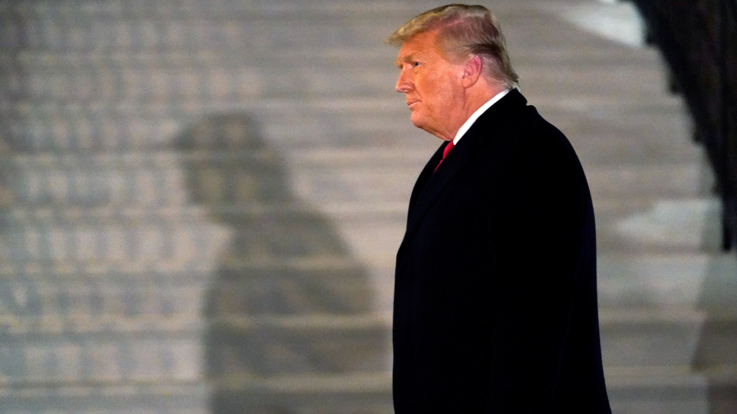 In this Tuesday, Jan. 12, 2021, file photo, President Donald Trump arrives on the South Lawn of the White House, in Washington, after returning from Texas. (AP Photo/Gerald Herbert)