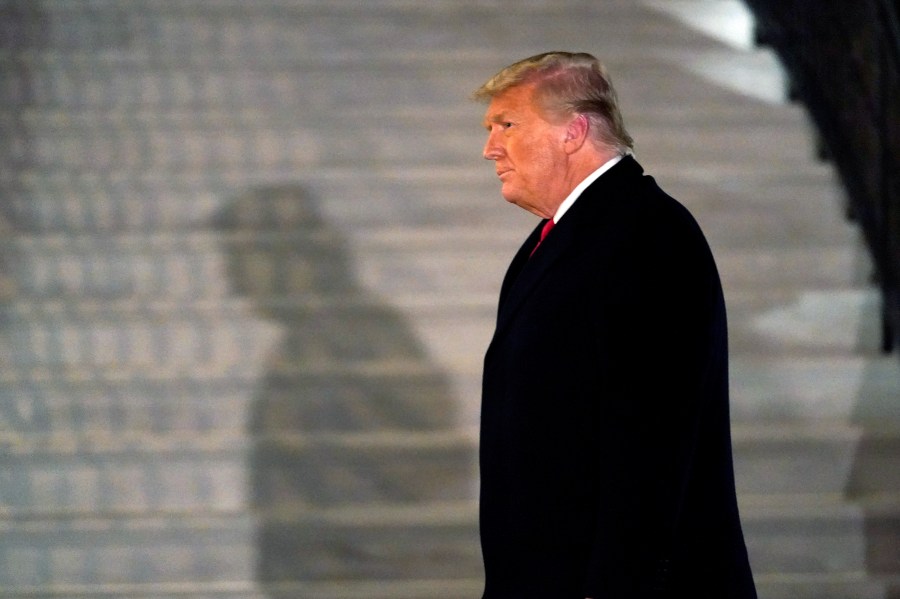 In this Tuesday, Jan. 12, 2021, file photo, President Donald Trump arrives on the South Lawn of the White House, in Washington, after returning from Texas. (AP Photo/Gerald Herbert)