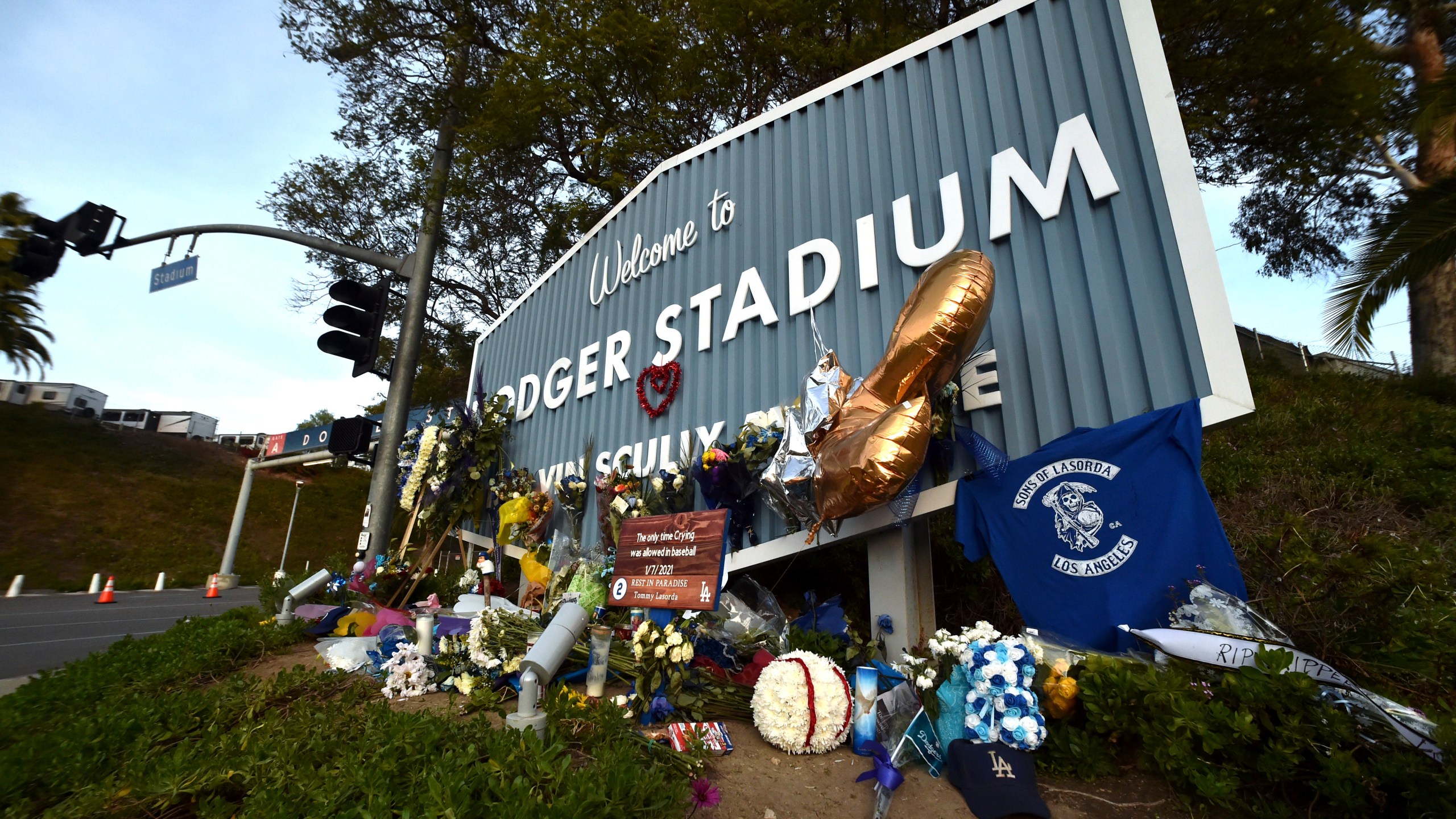 A makeshift memorial along Vin Scully Way in front of Dodger Stadium in Los Angeles on Jan. 13, 2021, honors former Dodgers manager Tommy Lasorda, who died last week. (Keith Birmingham/The Orange County Register via AP)