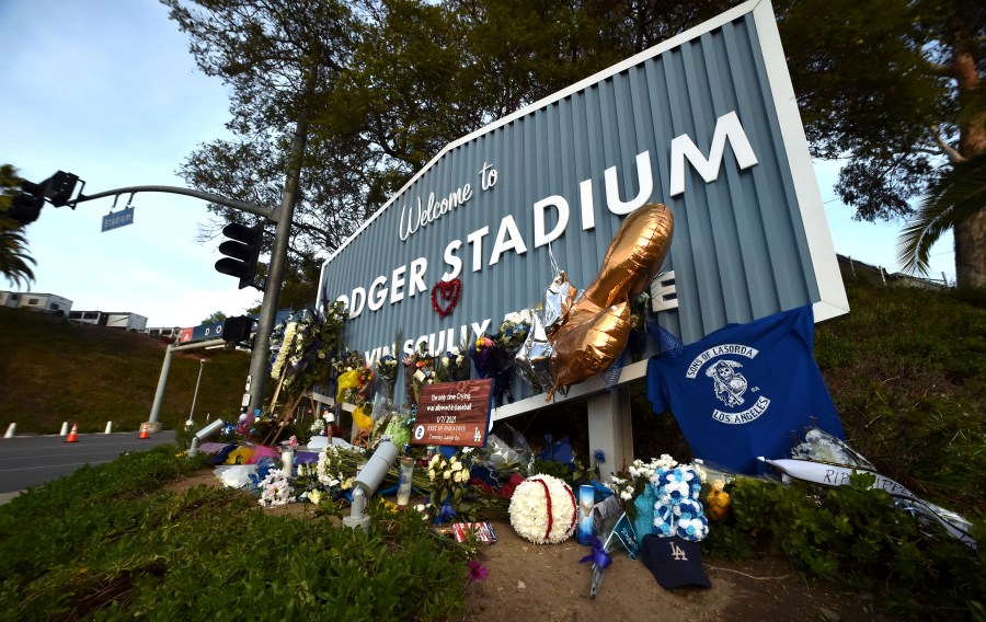 A makeshift memorial along Vin Scully Way in front of Dodger Stadium in Los Angeles on Jan. 13, 2021, honors former Dodgers manager Tommy Lasorda, who died last week. (Keith Birmingham/The Orange County Register via AP)