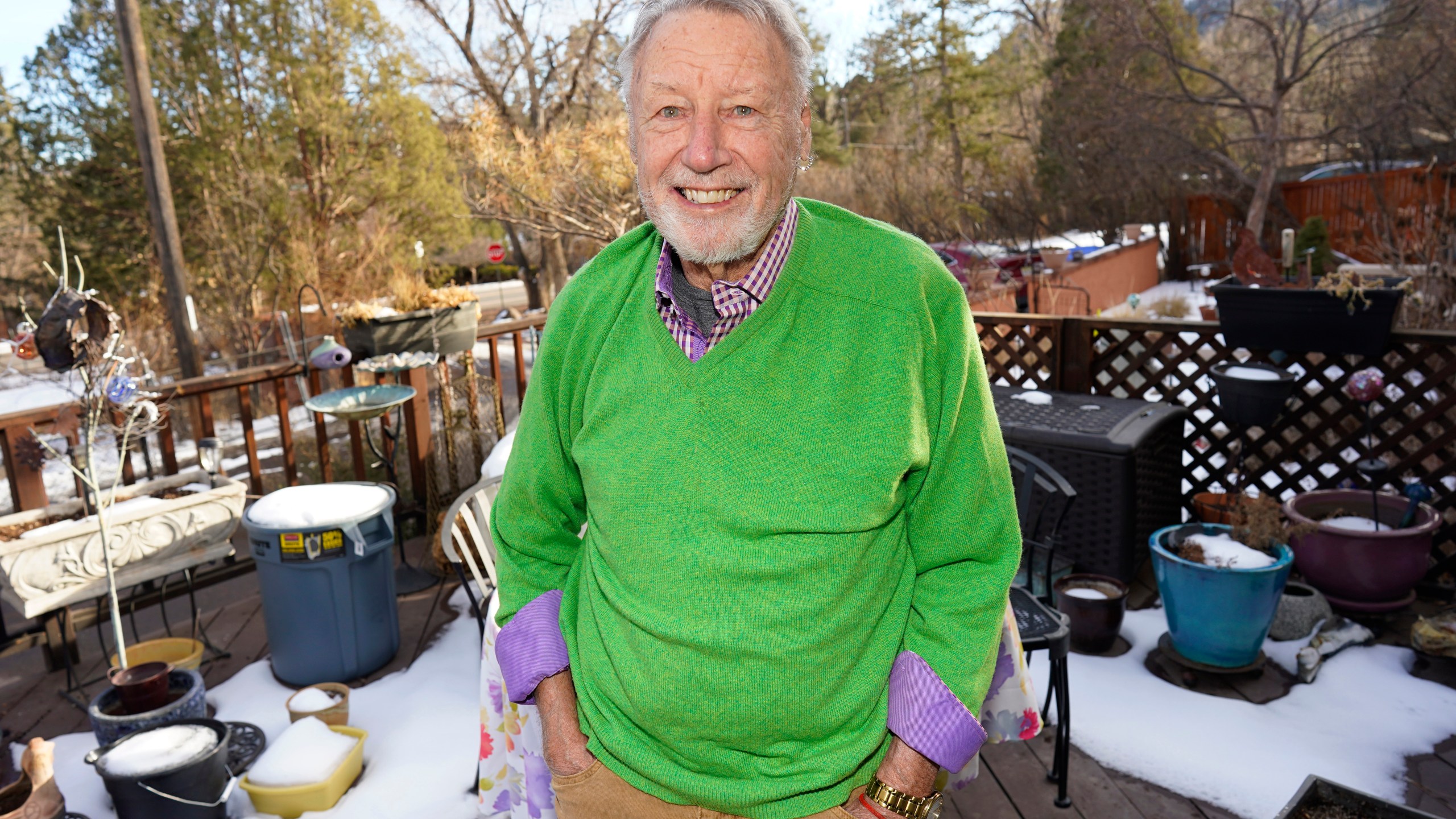 Howard Jones, an 83-year-old veteran, talks about his struggle to secure a COVID-19 vaccination in El Paso County while seated on the deck outside his home Tuesday, Jan. 12, 2021, in southwest Colorado Springs, Colo. (AP Photo/David Zalubowski)