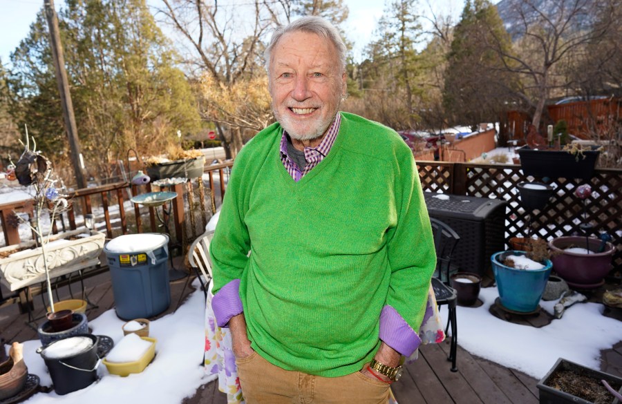 Howard Jones, an 83-year-old veteran, talks about his struggle to secure a COVID-19 vaccination in El Paso County while seated on the deck outside his home Tuesday, Jan. 12, 2021, in southwest Colorado Springs, Colo. (AP Photo/David Zalubowski)