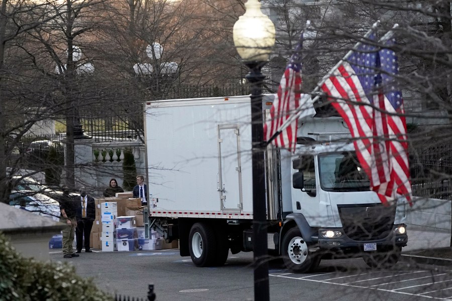 A van arrives to pick up boxes that were moved out of the Eisenhower Executive Office building, inside the White House complex on Jan. 14, 2021, in Washington D.C. (AP Photo/Gerald Herbert)