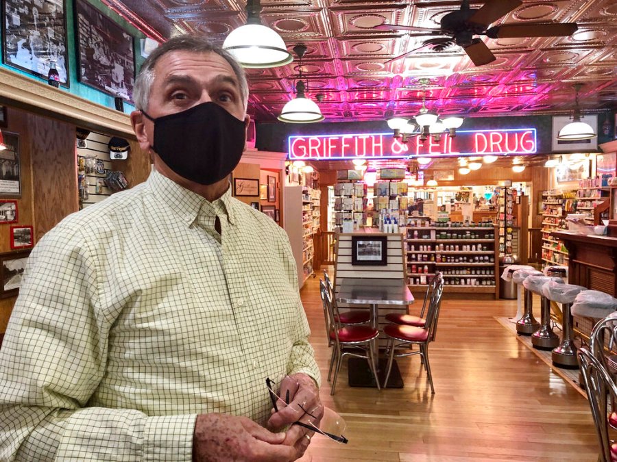 Pharmacist Ric Griffith stands in his family's business Friday, Jan. 15, 2021, in Kenova, W.Va. Griffith & Feil is among 250 mom-and-pop pharmacies in West Virginia helping to vaccinate residents in the quest to banish the coronavirus pandemic. (AP Photo/John Raby)