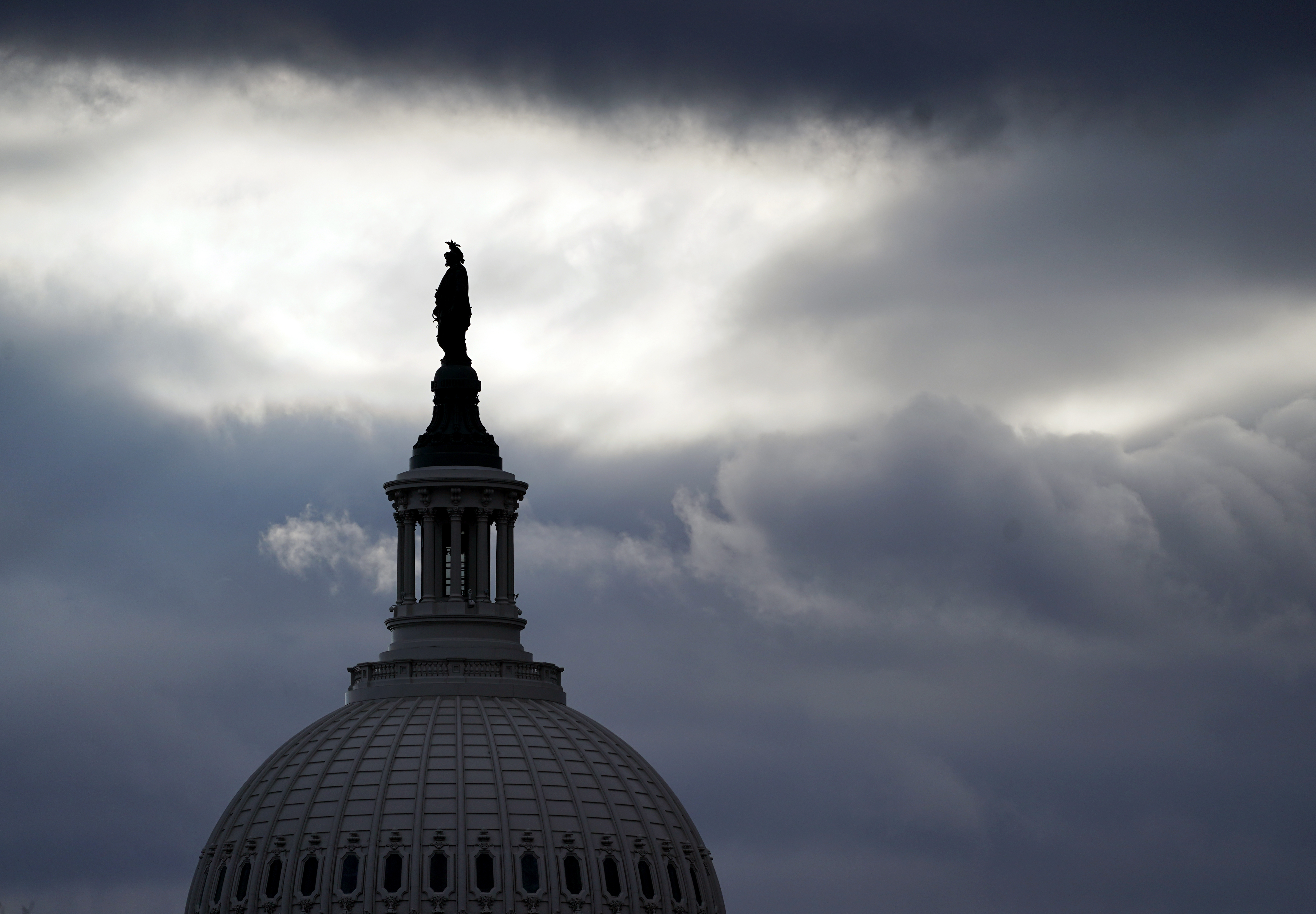 The bronze Statue of Freedom, by Thomas Crawford, is the crowning feature of the dome of the U.S. Capitol, shown ahead of the inauguration of President-elect Joe Biden and Vice President-elect Kamala Harris, Sunday, Jan. 17, 2021, in Washington. (AP Photo/Julio Cortez)