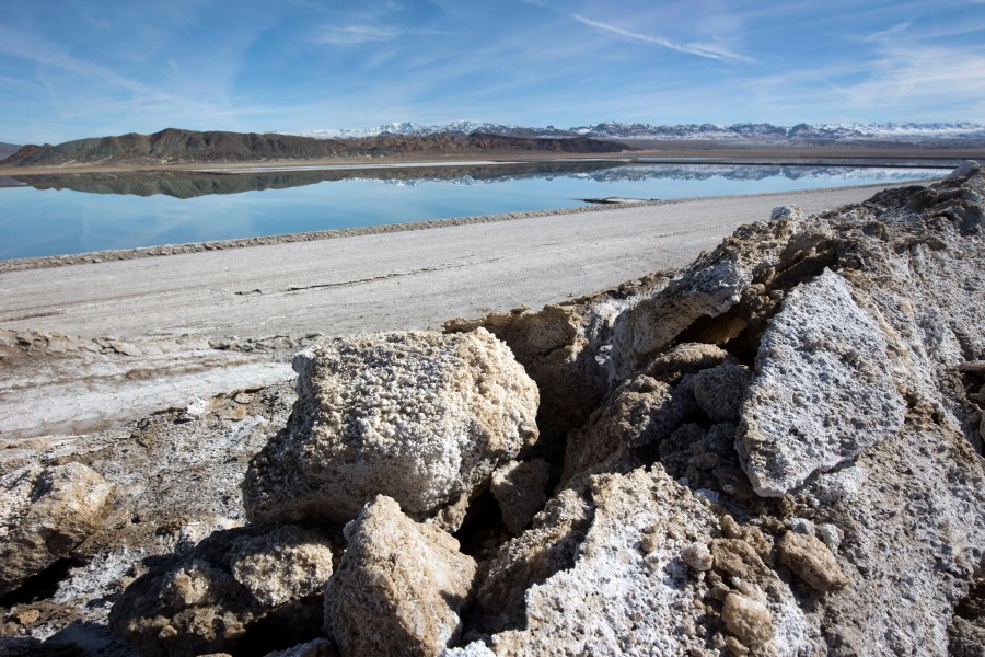 In this Jan. 30, 2017, file photo, waste salt, foreground, is shown near an evaporation pond at the Silver Peak lithium mine near Tonopah, Nev. (Steve Marcus/Las Vegas Sun via AP)