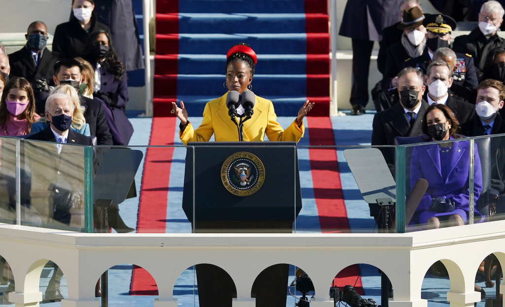 National youth poet laureate Amanda Gorman recites her inaugural poem during the 59th Presidential Inauguration at the U.S. Capitol in Washington, Wednesday, Jan. 20, 2021. Joe Biden became the 46th president of the United States on Wednesday. (AP Photo/Patrick Semansky, Pool)