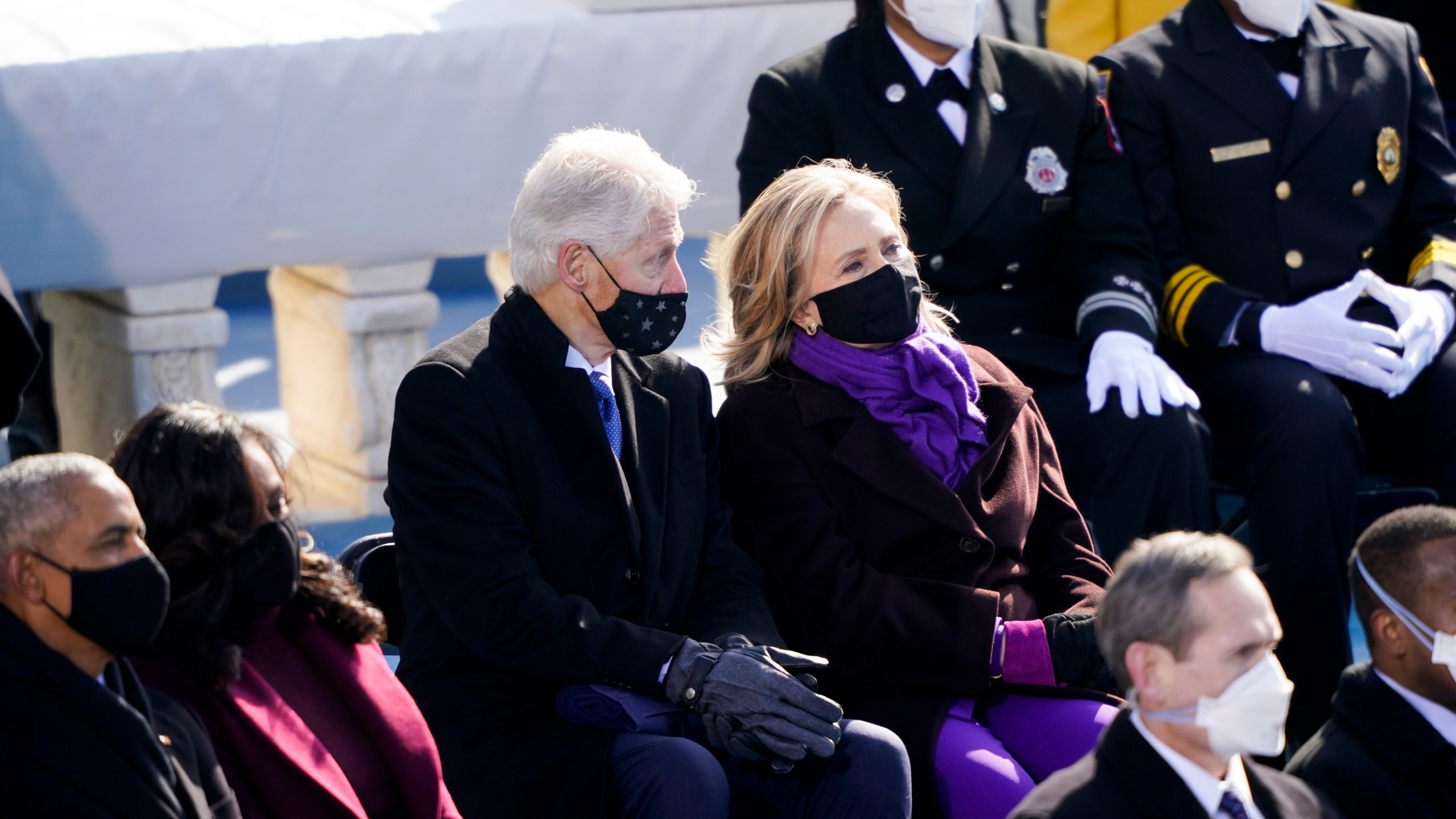 Former President Barack Obama and his wife Michelle and former President Bill Clinton and former Secretary of State Hillary Clinton attend the 59th Presidential Inauguration at the U.S. Capitol in Washington, Wednesday, Jan. 20, 2021. (AP Photo/Carolyn Kaster)