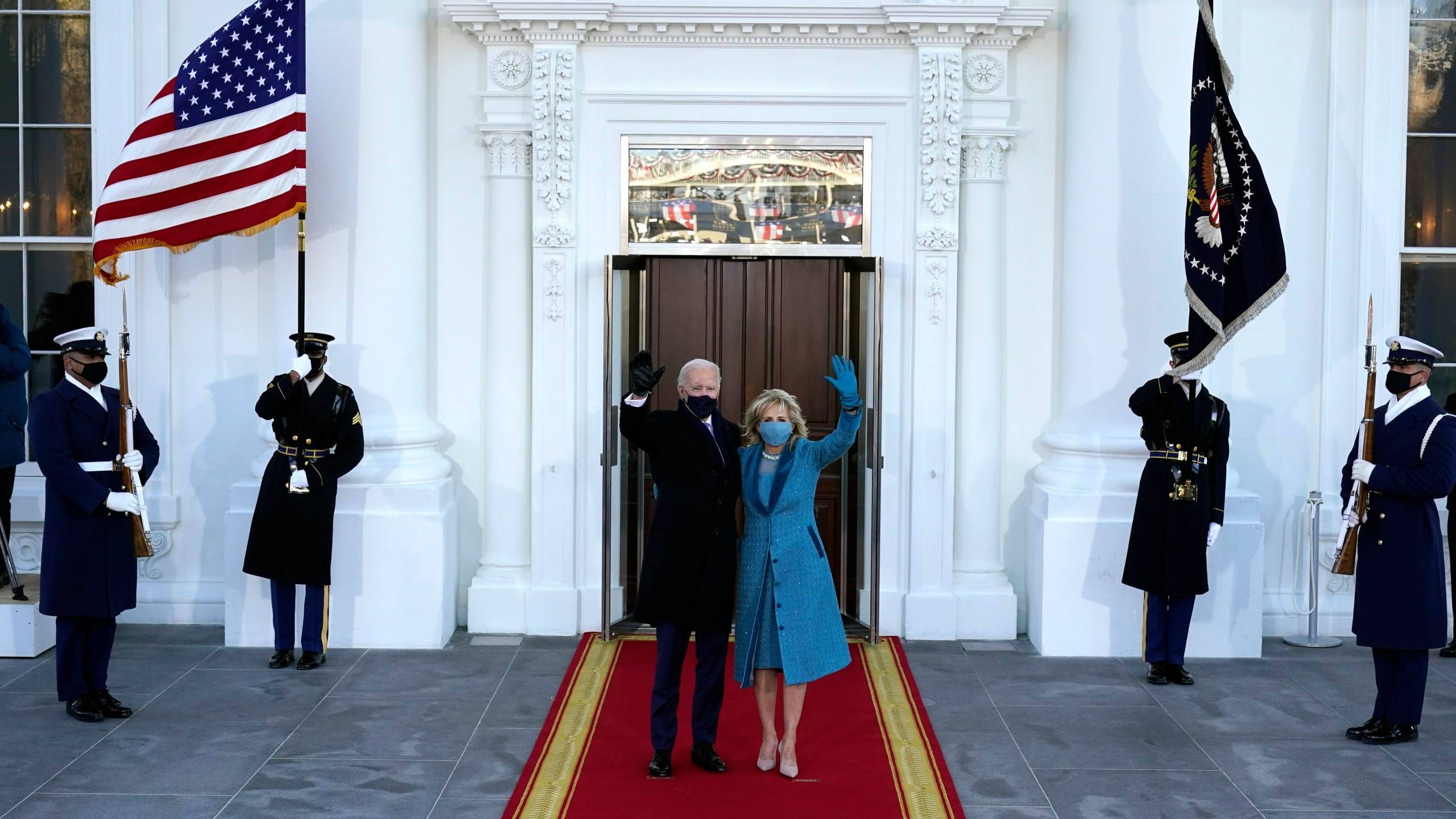 President Joe Biden and first lady Jill Biden wave as they arrive at the North Portico of the White House, Wednesday, Jan. 20, 2021, in Washington. (AP Photo/Alex Brandon, Pool)