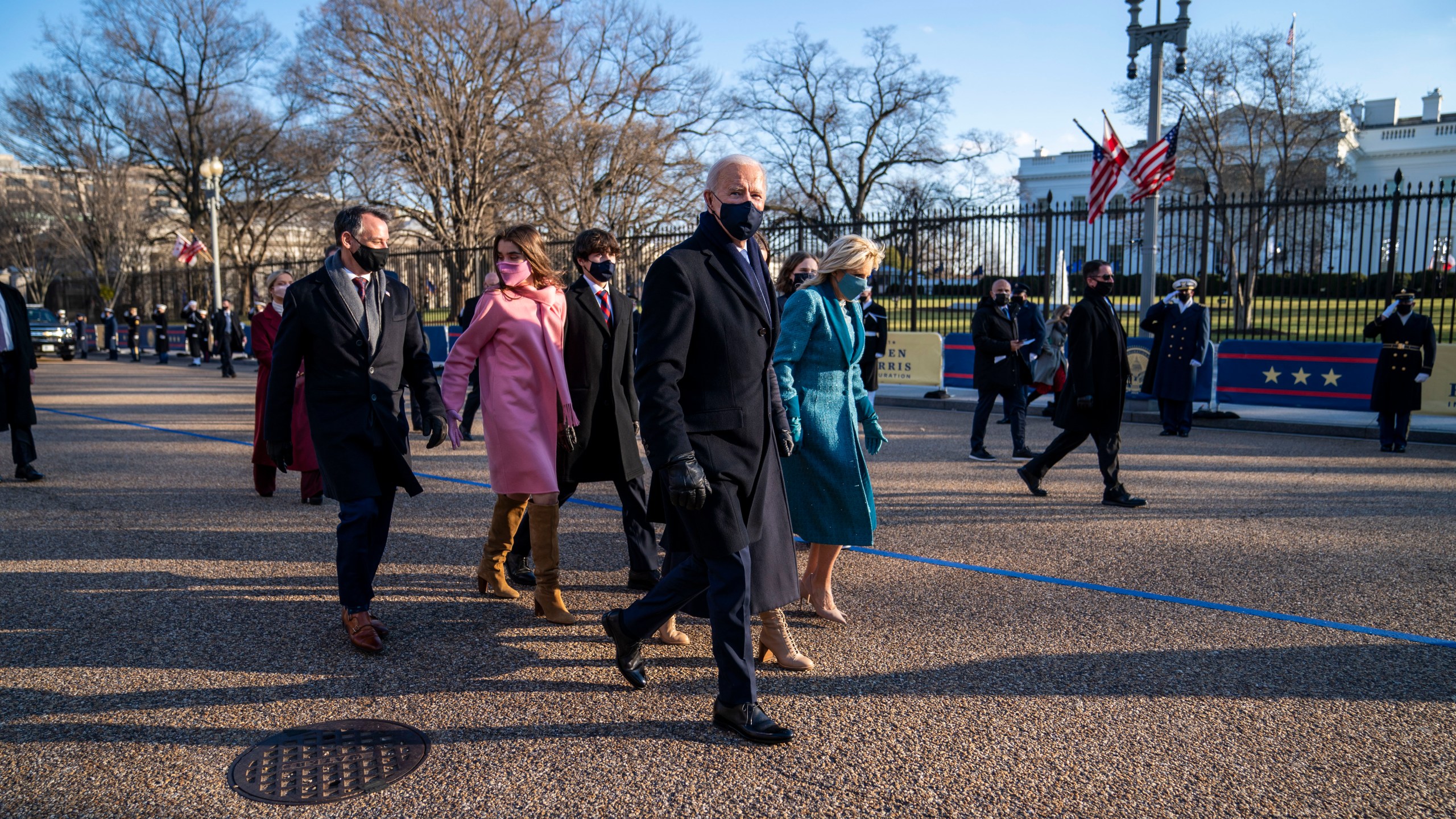 President Joe Biden, First Lady Jill Biden and family, walk in front of the White House during a Presidential Escort to the White House, Wednesday, Jan. 20, 2021 in Washington. (Doug Mills/The New York Times via AP)