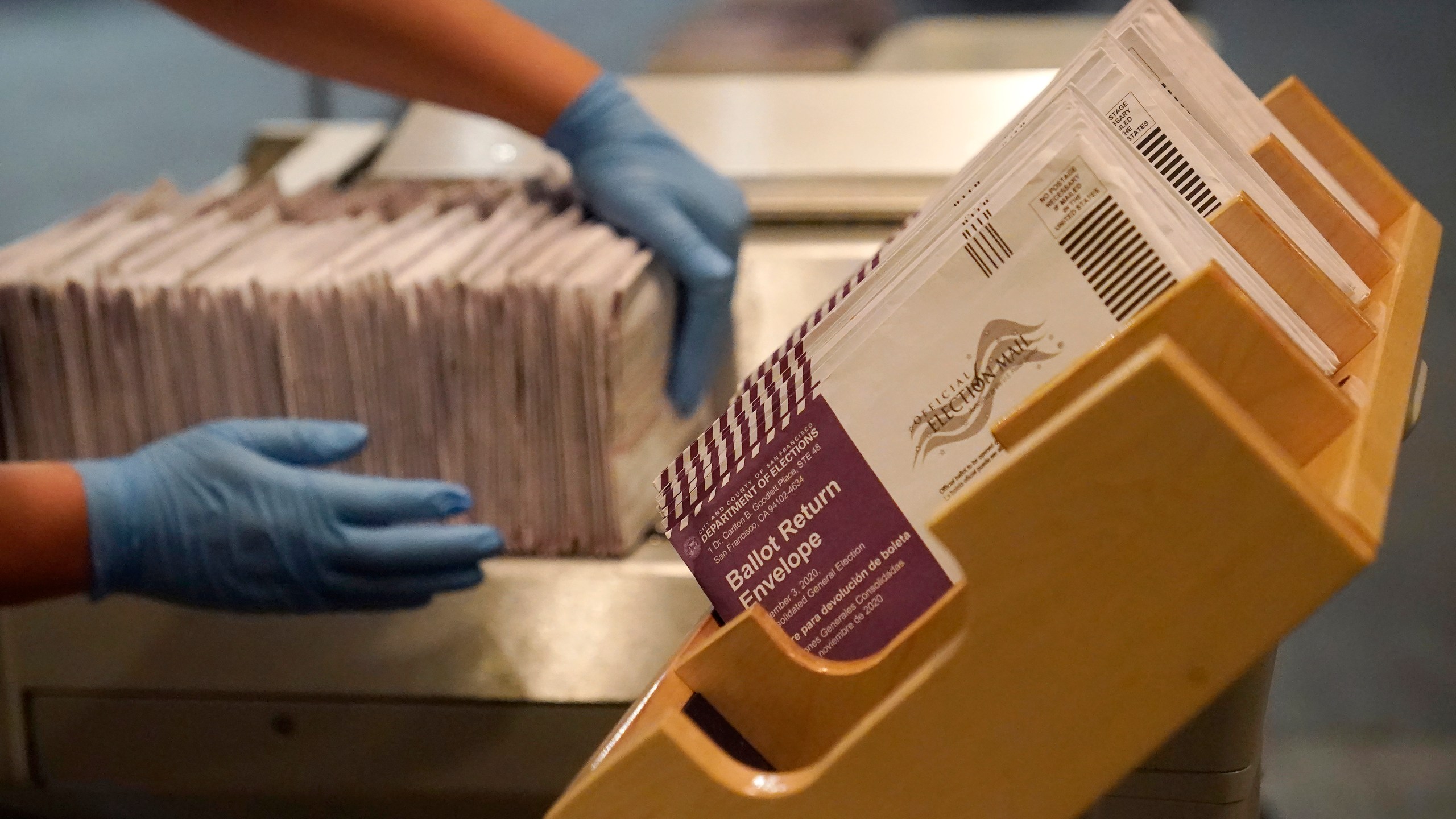 In this Nov. 1, 2020, file photo, envelopes containing ballots are shown at a San Francisco Department of Elections at a voting center in San Francisco. (AP Photo/Jeff Chiu)