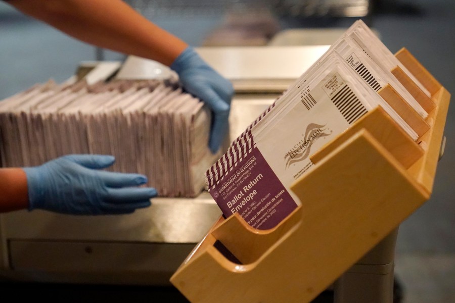 In this Nov. 1, 2020, file photo, envelopes containing ballots are shown at a San Francisco Department of Elections at a voting center in San Francisco. (AP Photo/Jeff Chiu)