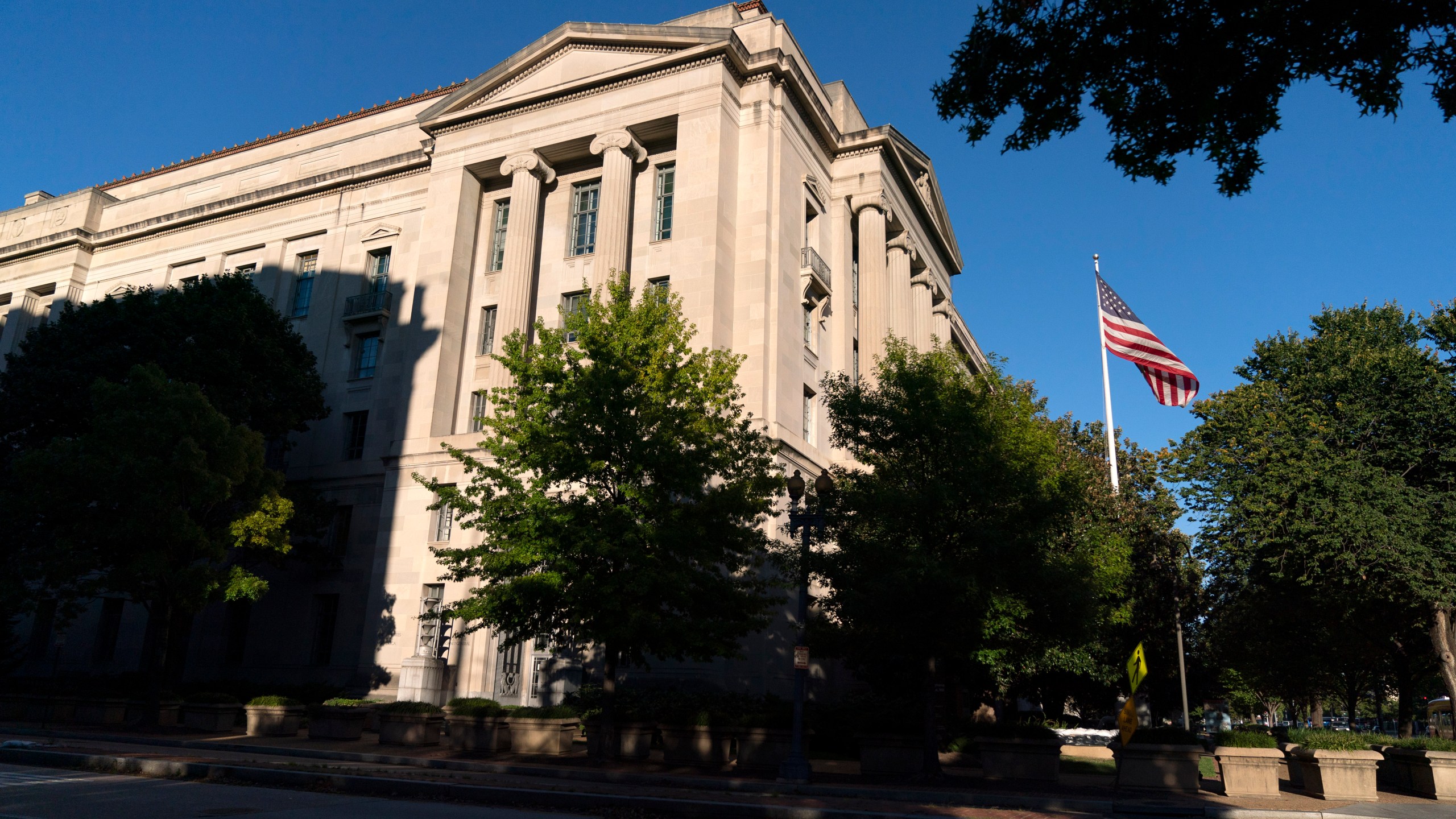 In this Oct. 8, 2020, file photo an American flag flies outside of the Justice Department building in Washington. (AP Photo/Jacquelyn Martin)In this Oct. 8, 2020, file photo an American flag flies outside of the Justice Department building in Washington. (AP Photo/Jacquelyn Martin)