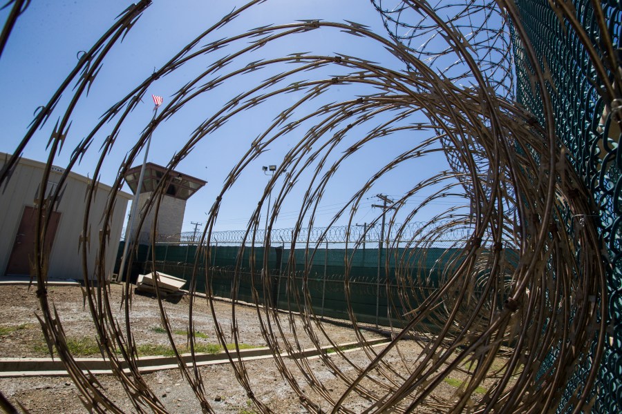 In this Wednesday, April 17, 2019 file photo reviewed by U.S. military officials, the control tower is seen through the razor wire inside the Camp VI detention facility in Guantanamo Bay Naval Base, Cuba. (AP Photo/Alex Brandon)