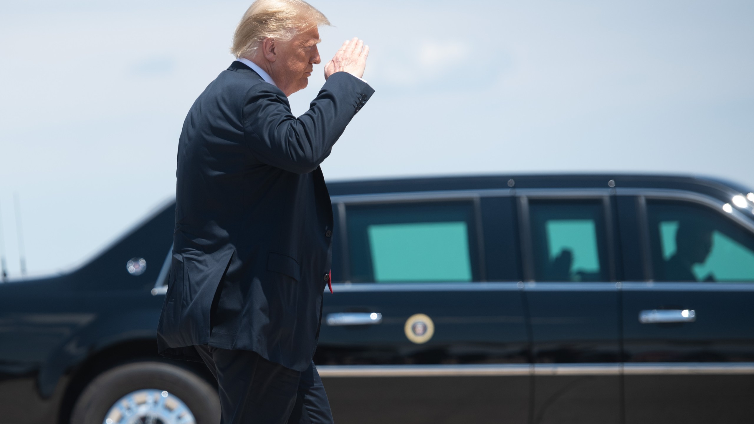 US President Donald Trump gets out of the presidential limousine as he prepares to board Air Force One prior to departure from Joint Base Andrews in Maryland, June 25, 2020, as he travels to Wisconsin. (Saul Loeb/AFP via Getty Images)