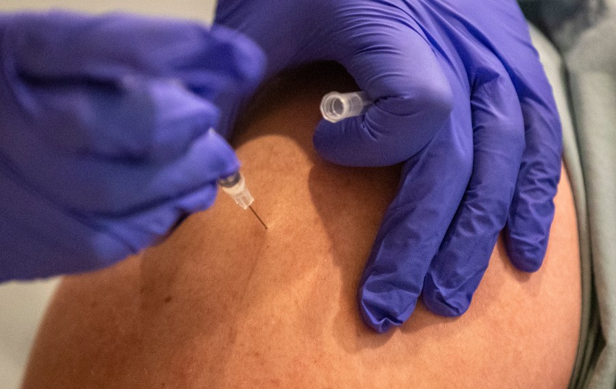 UCLA physician Russell Johnson gets an injection of the COVID-19 vaccine at Ronald Reagan UCLA Medical Center on Dec. 16, 2020 in Westwood, California. ( Brian van der Brug-Pool/Getty Images)