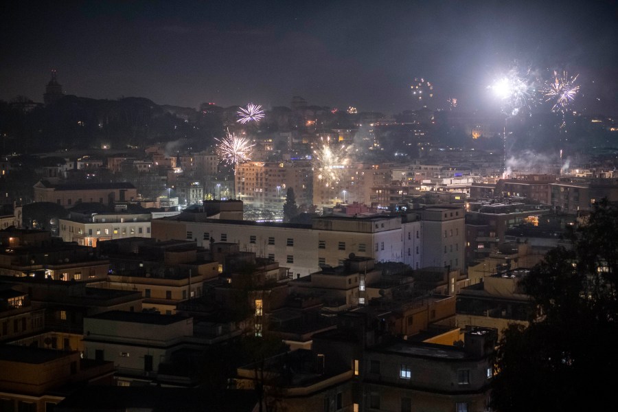 Fireworks are seen over the city of Rome while people celebrate New Year's Eve during the Coronavirus pandemic on January 01, 2021, in Rome, Italy. (Antonio Masiello/Getty Images)