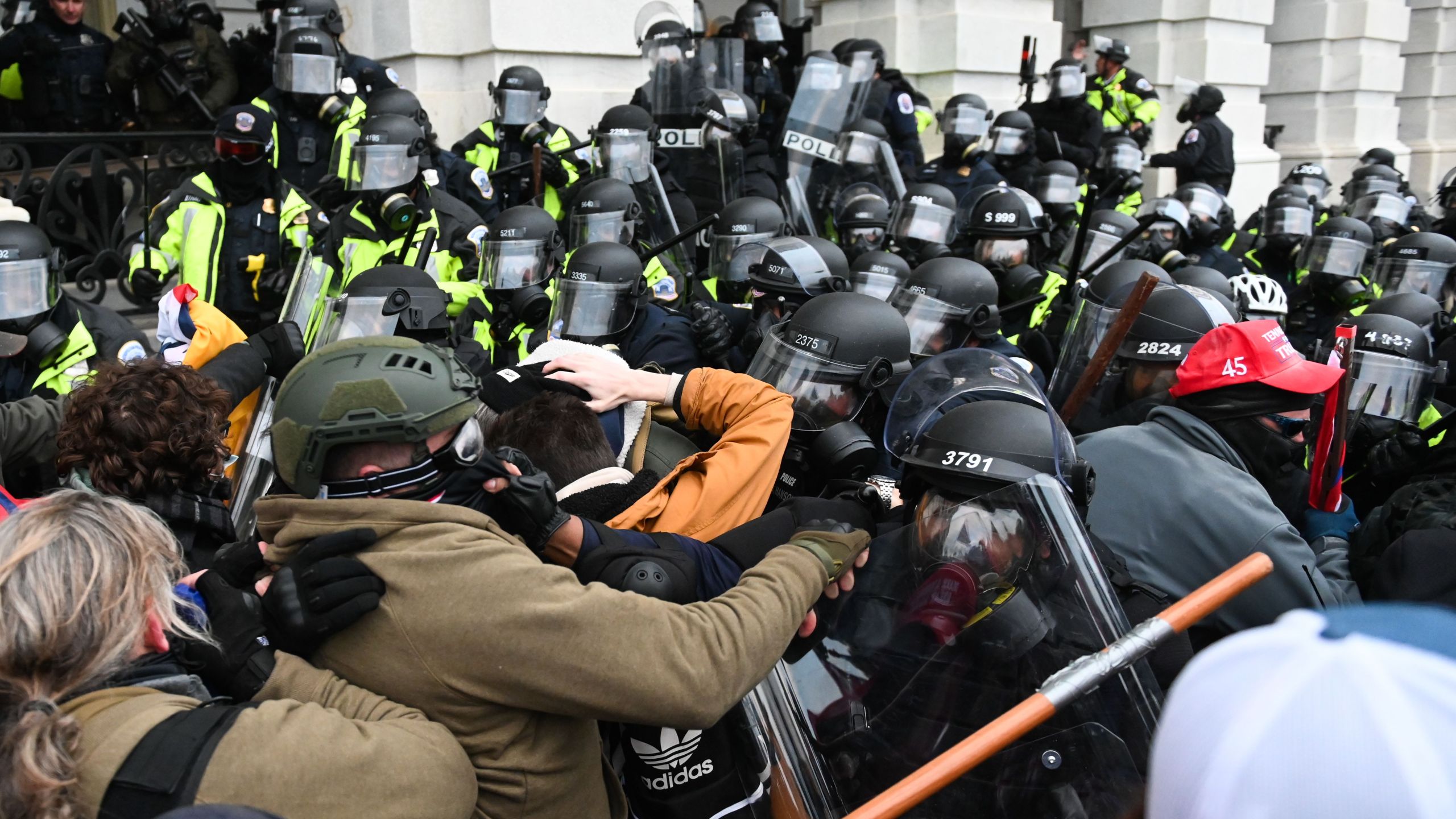 Riot police push back a crowd of supporters of President Donald Trump after they stormed the U.S. Capitol building on Jan. 6, 2021. (ROBERTO SCHMIDT / AFP / Getty Images)