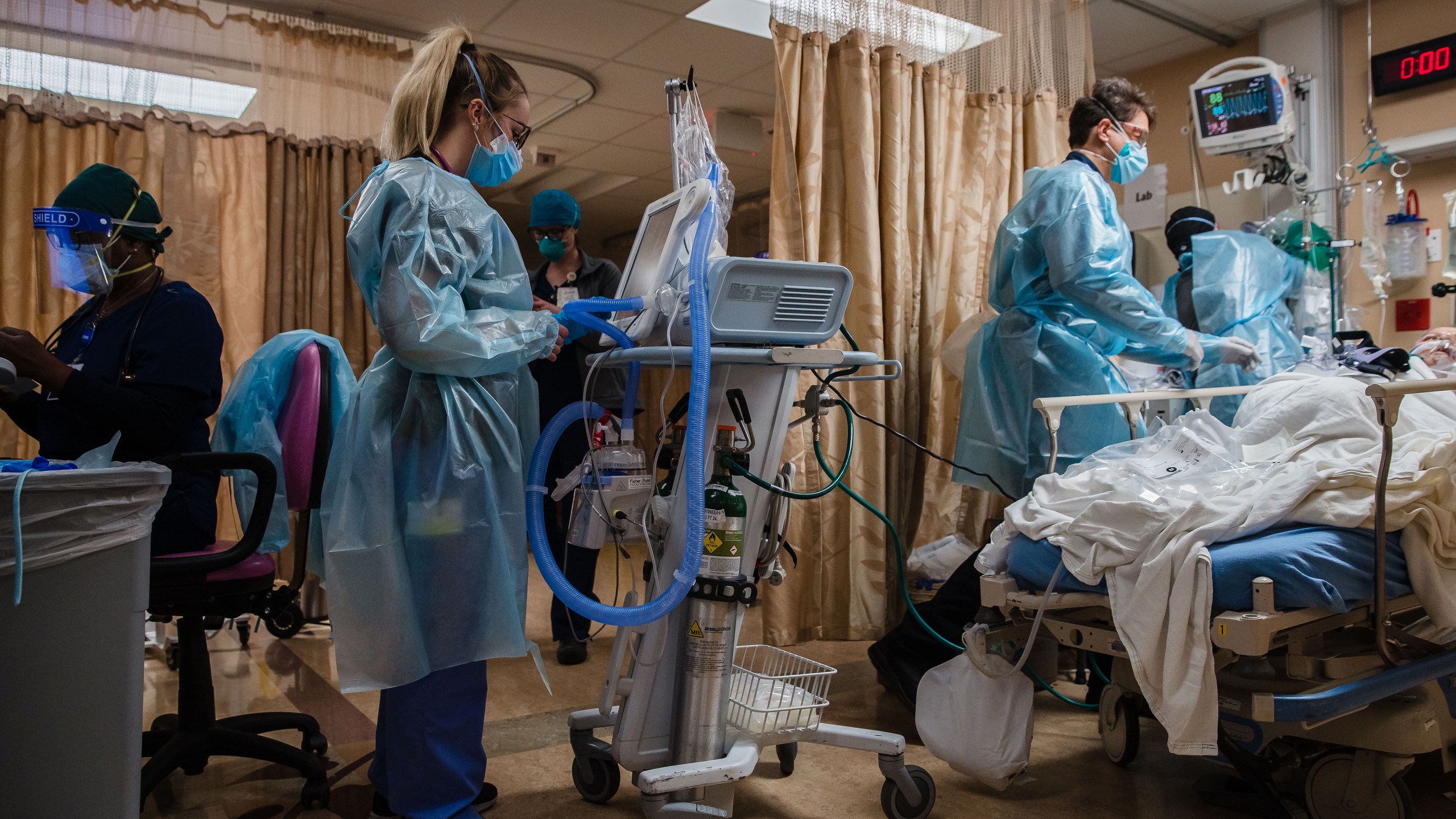 Health care workers tend to a COVID-19 patient at Providence St. Mary Medical Center in Apple Valley on Jan. 11, 2021. (Ariana Drehsler/AFP via Getty Images)