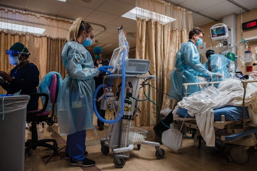 Health care workers tend to a COVID-19 patient at Providence St. Mary Medical Center in Apple Valley on Jan. 11, 2021. (Ariana Drehsler/AFP via Getty Images)