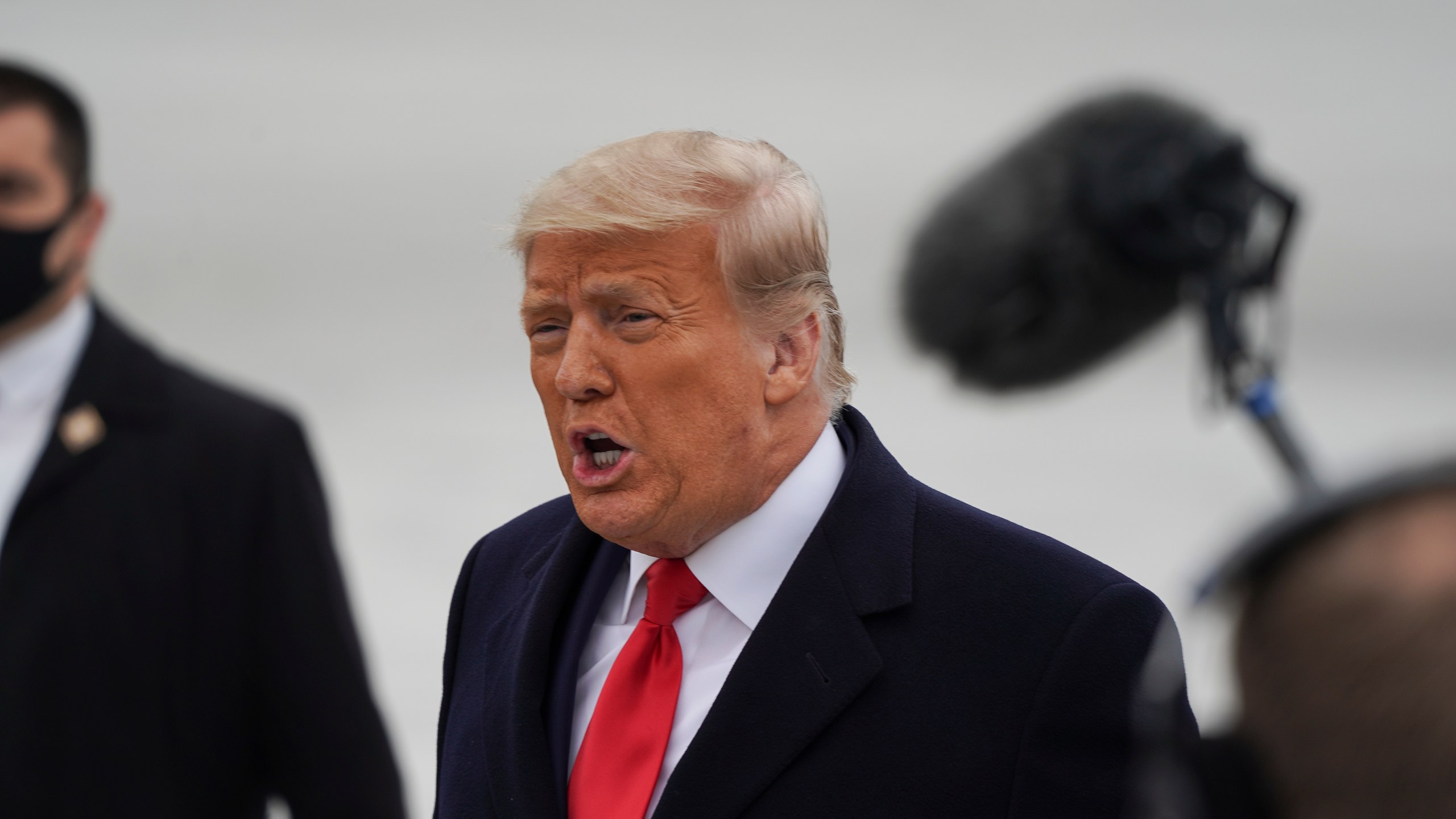 President Donald Trump greets his supporters at Valley International Airport in Harlingen, Texas, on Jan. 12, 2021. (Go Nakamura / Getty Images)