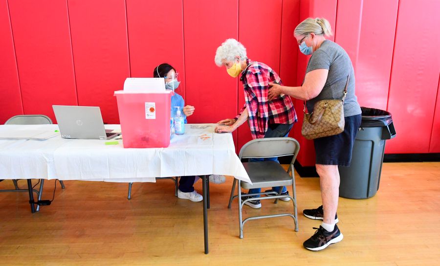 Beverly Goad, 89, arrives for her COVID-19 vaccine at the Corona High School gymnasium in Corona on Jan. 15, 2021. (FREDERIC J. BROWN/AFP via Getty Images)