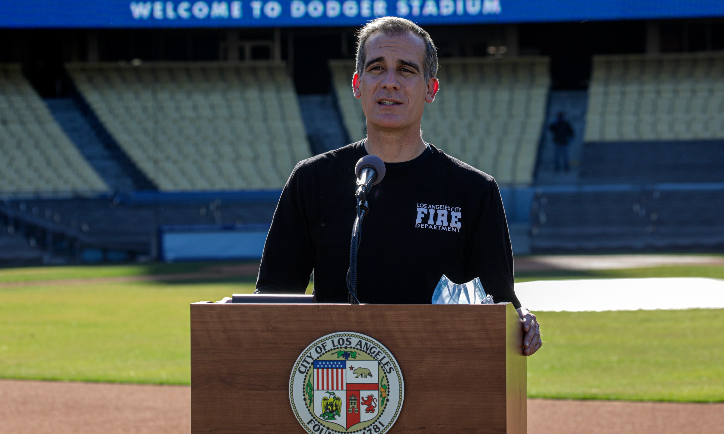 Los Angeles Mayor Eric Garcetti addresses a press conference held at the launch of a mass COVID-19 vaccination site at Dodger Stadium on Jan. 15, 2021. (Irfan Khan / AFP / Getty Images)