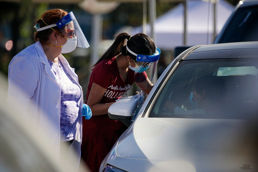 COVID-19 mass-vaccination of health care workers takes place at Dodger Stadium on Jan. 15, 2021 in Los Angeles. (IRFAN KHAN/POOL/AFP via Getty Images)