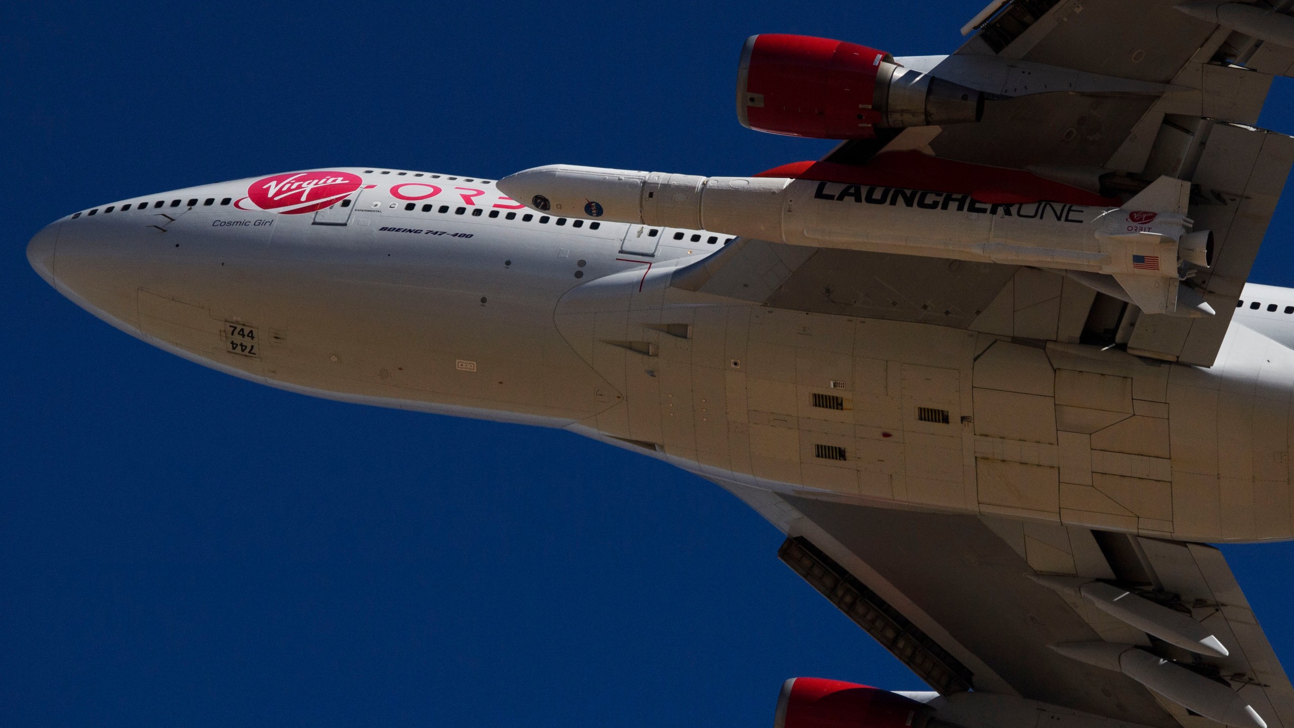 The Virgin Orbit "Cosmic Girl" - a modified Boeing Co. 747-400 carrying a LauncherOne rocket under it's wing - takes off for the Launch Demo 2 mission from Mojave Air and Space Port on January 17, 2021 in Mojave, California. (Patrick T. Fallon/AFP via Getty Images)