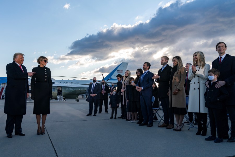 President Donald Trump and first lady Melania Trump meet Ivanka Trump (second from right), husband Jared Kushner (right), their children, Eric and Donald Jr. (both center-right) and Trump family members stand on the tarmac at Joint Base Andrews in Maryland as the outgoing president departs on Jan. 20, 2021. (Alex Edelman / AFP / Getty Images)