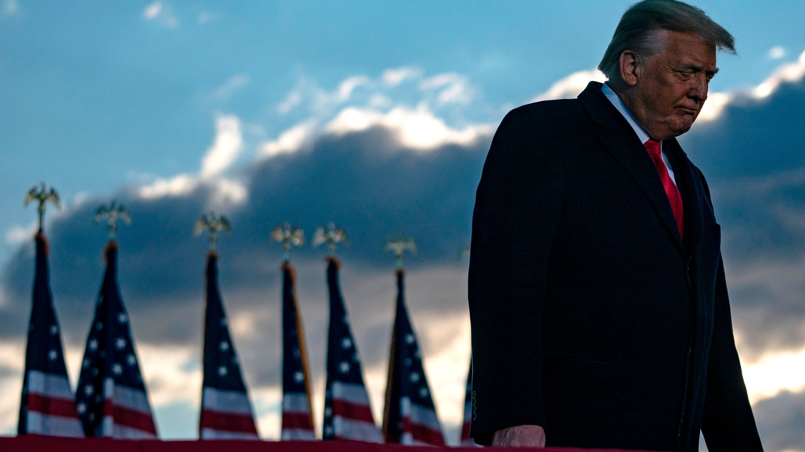 Donald Trump addresses guests at Joint Base Andrews in Maryland on Jan. 20, 2021. (ALEX EDELMAN/AFP via Getty Images)