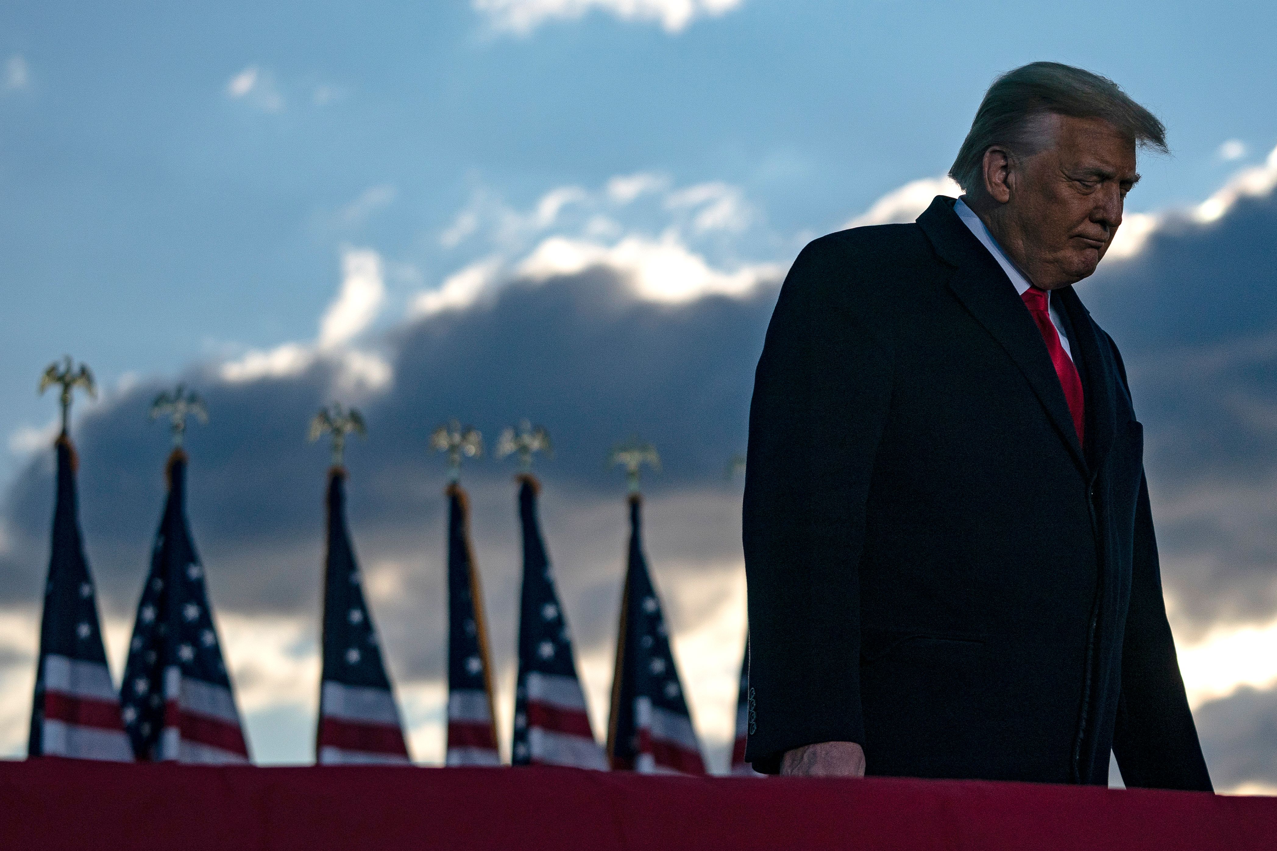 Donald Trump addresses guests at Joint Base Andrews in Maryland on Jan. 20, 2021. (ALEX EDELMAN/AFP via Getty Images)