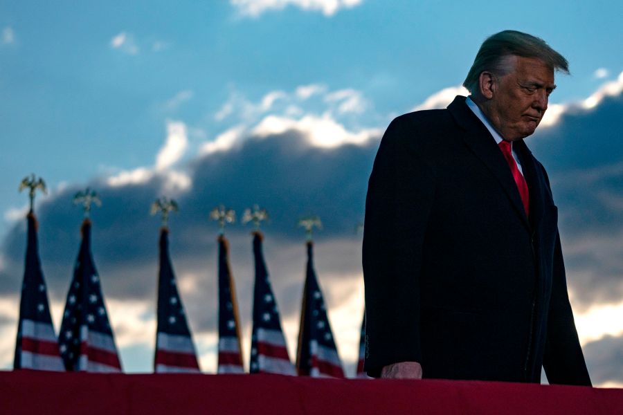 Donald Trump addresses guests at Joint Base Andrews in Maryland on Jan. 20, 2021. (ALEX EDELMAN/AFP via Getty Images)